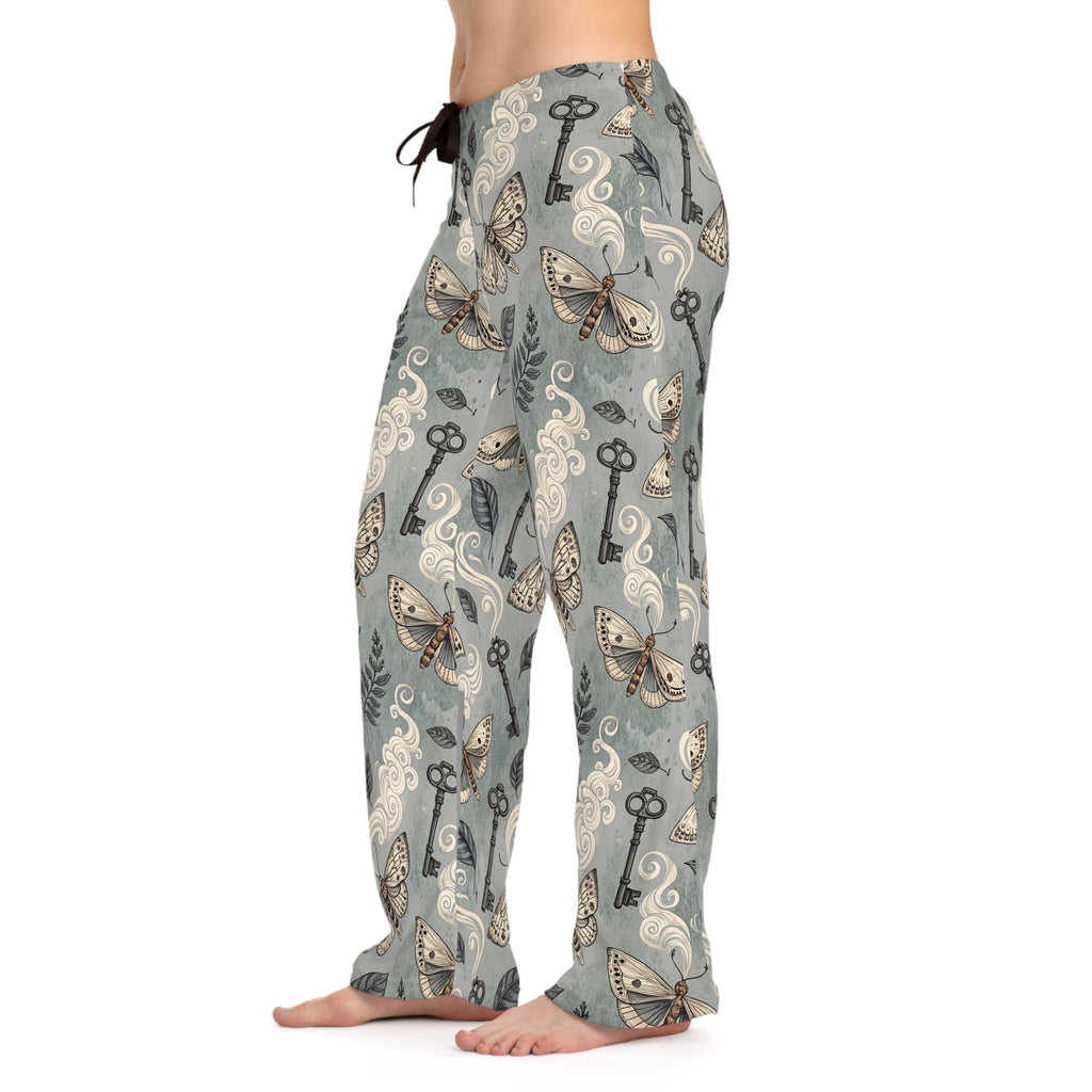 Pajama pants with moth and key pattern on a white background