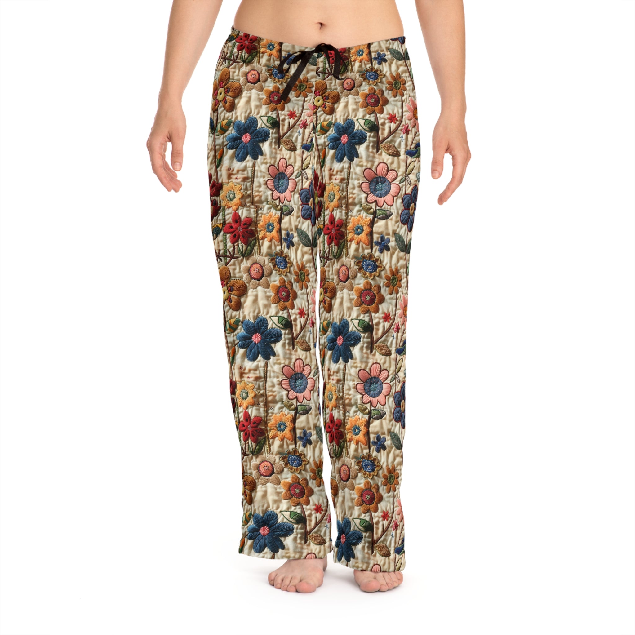 Floral patterned pants worn by a person on a white background
