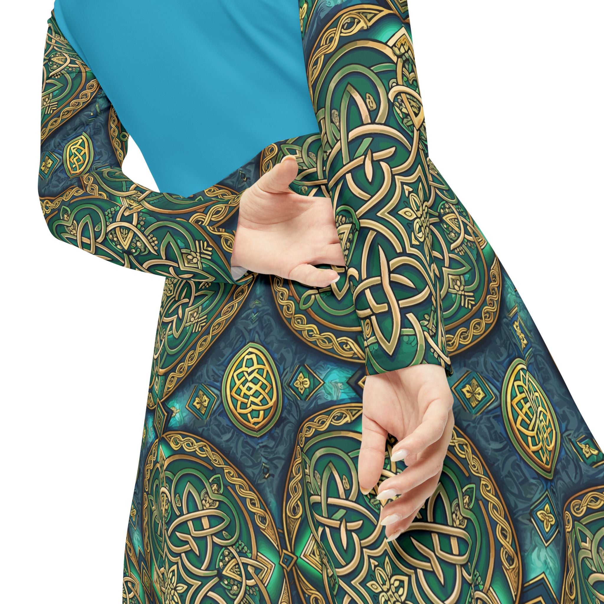 Close-up of a person wearing a blue and green patterned garment with intricate designs.