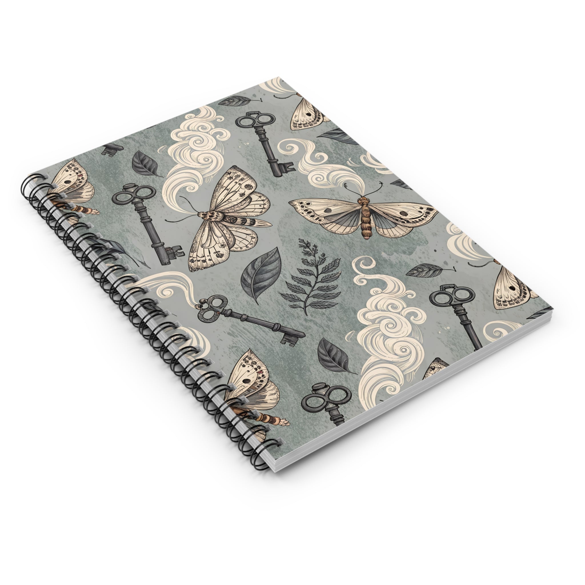 Notebook with moth and key design on a gray background