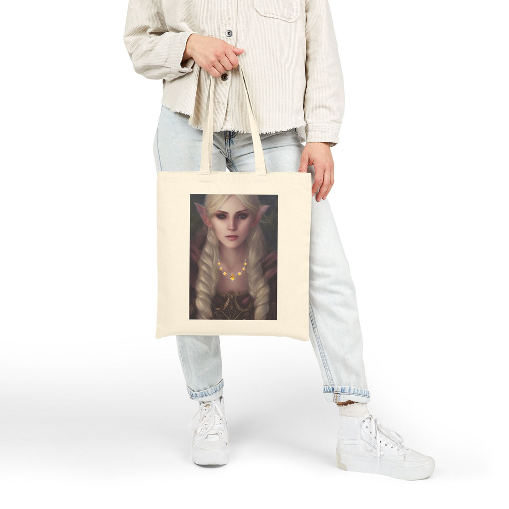 Person holding a tote bag with an elf design on a white background