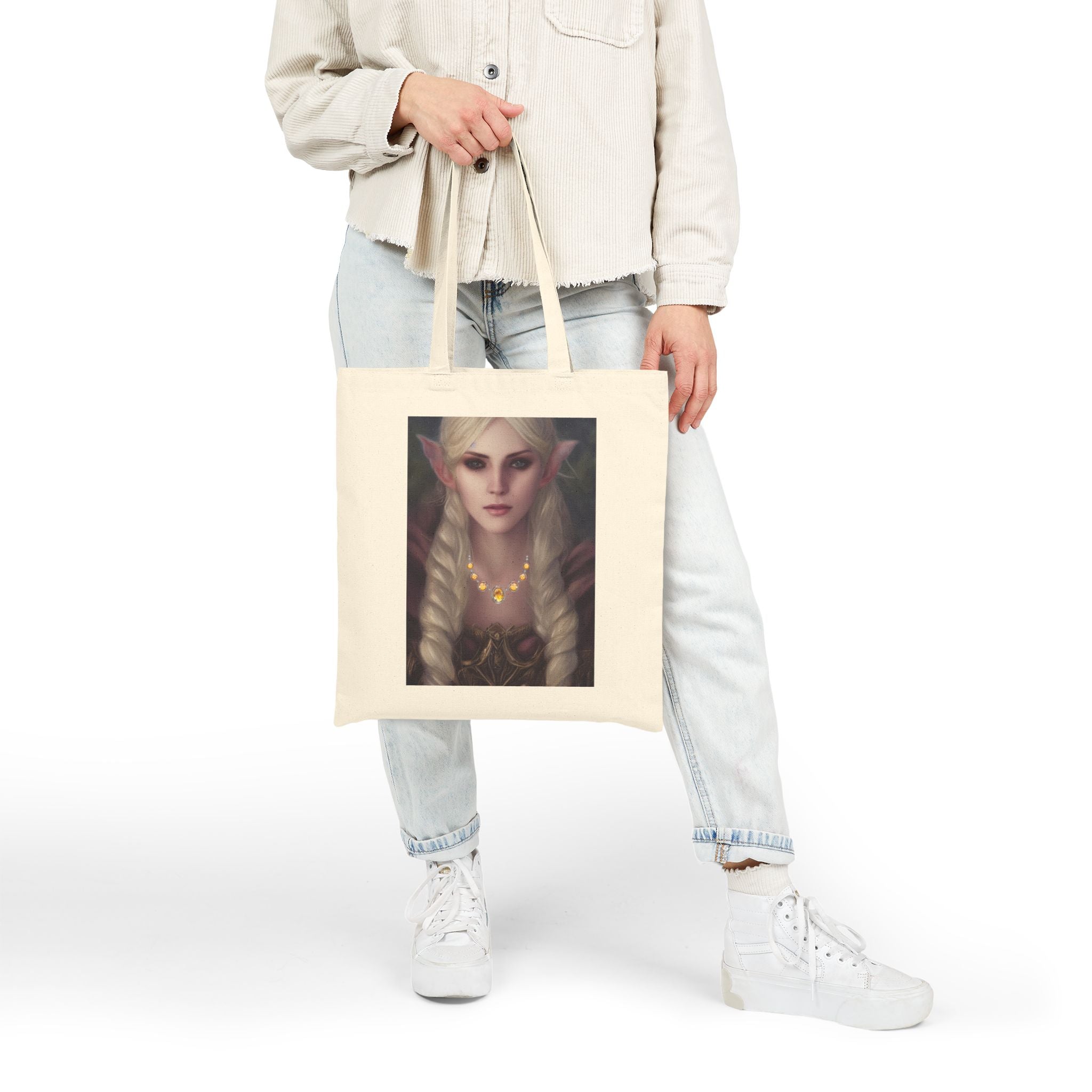 Person holding a tote bag with an elf design on a white background