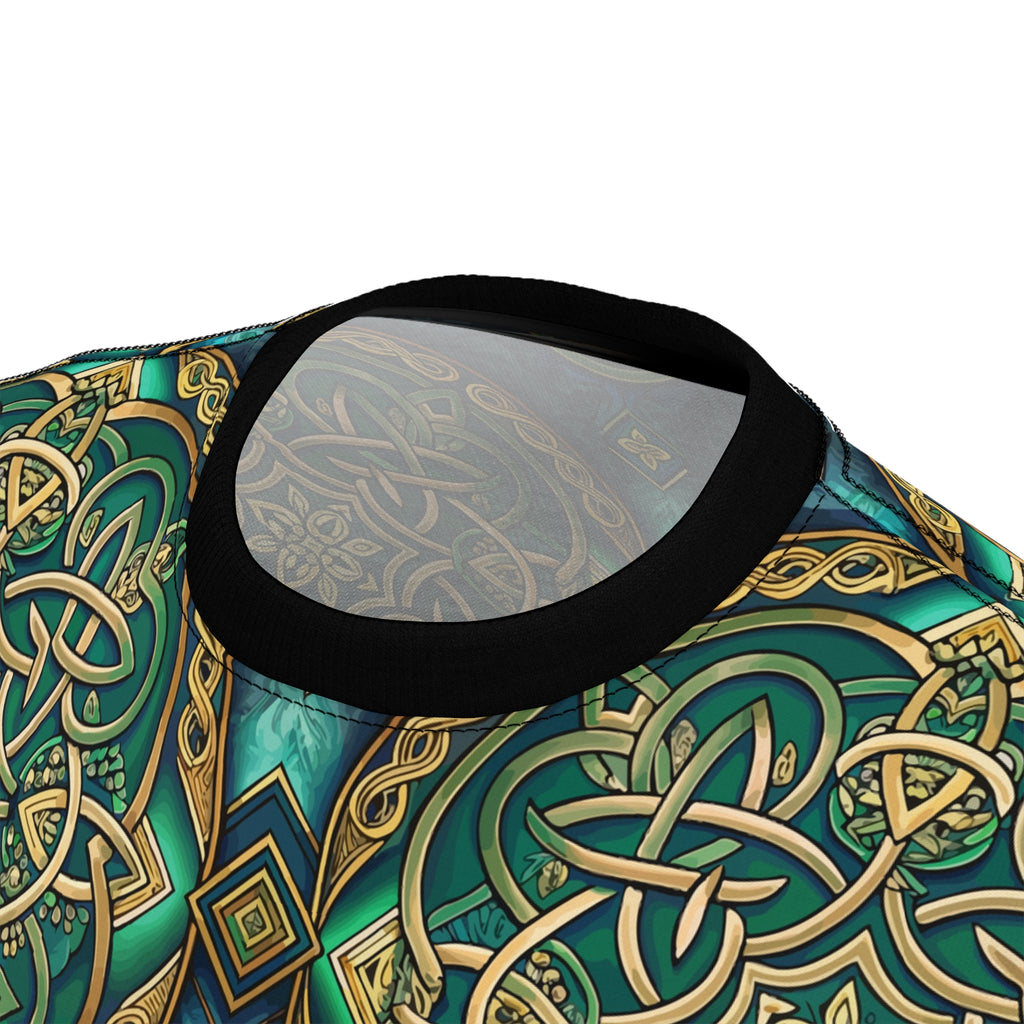 Close-up of a patterned fabric with Celtic knot designs in green and gold on a white background.