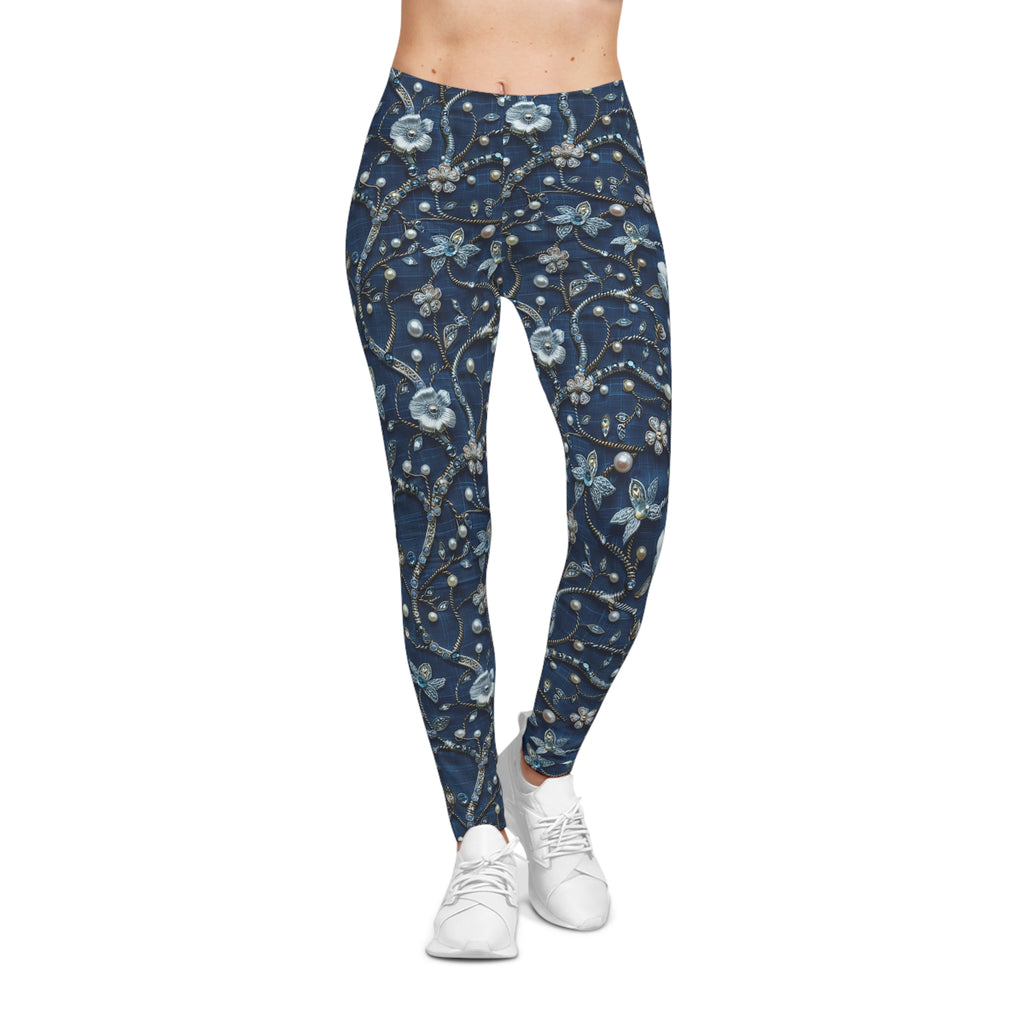 Navy leggings with floral pattern worn by a person on a white background