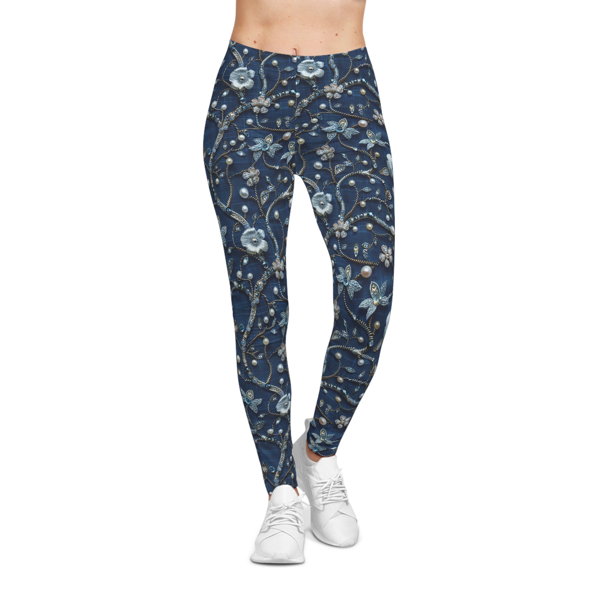Navy leggings with floral pattern worn by a person on a white background