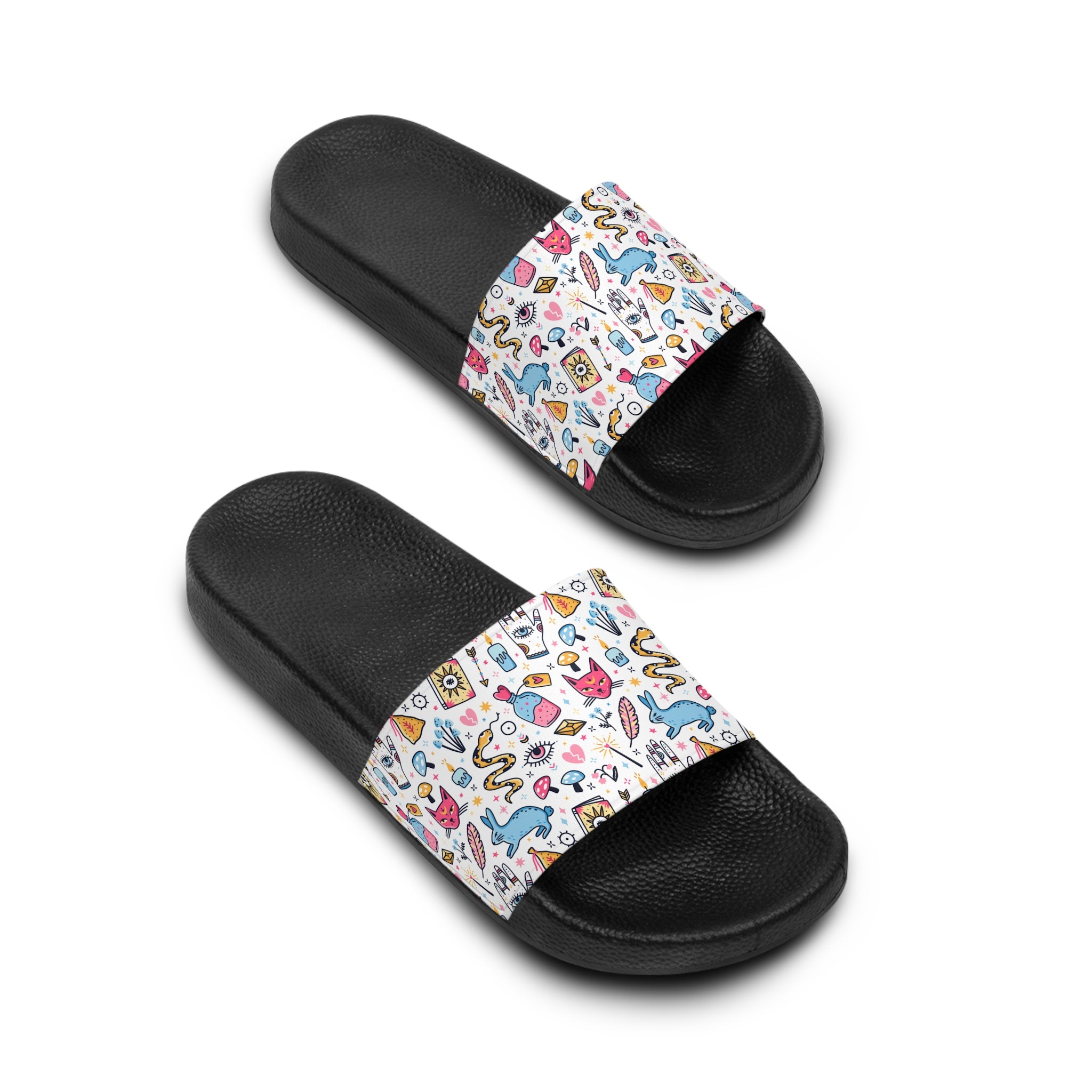Pair of black slide sandals with colorful patterned straps on a white background