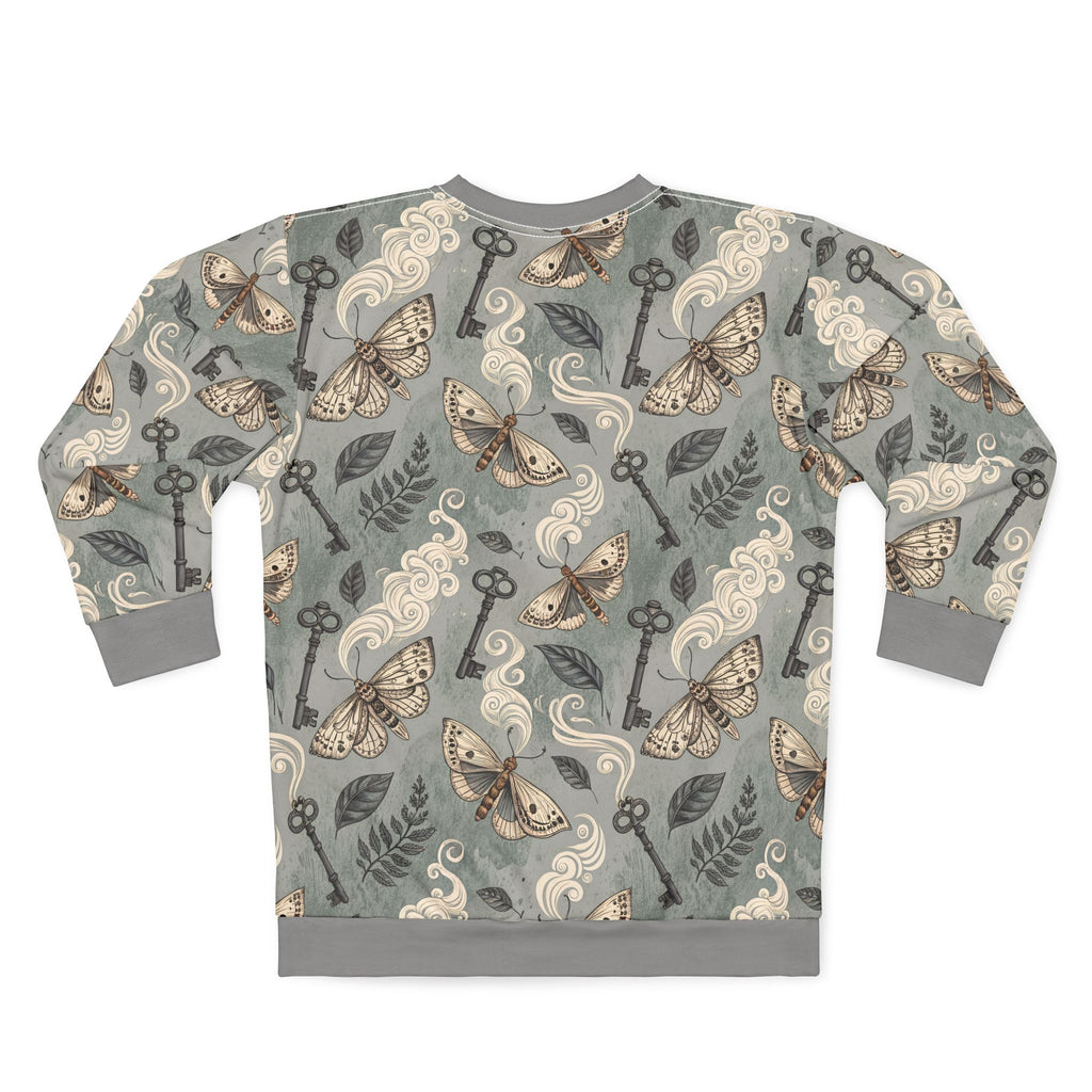 Sweatshirt with moth and key pattern on a gray background