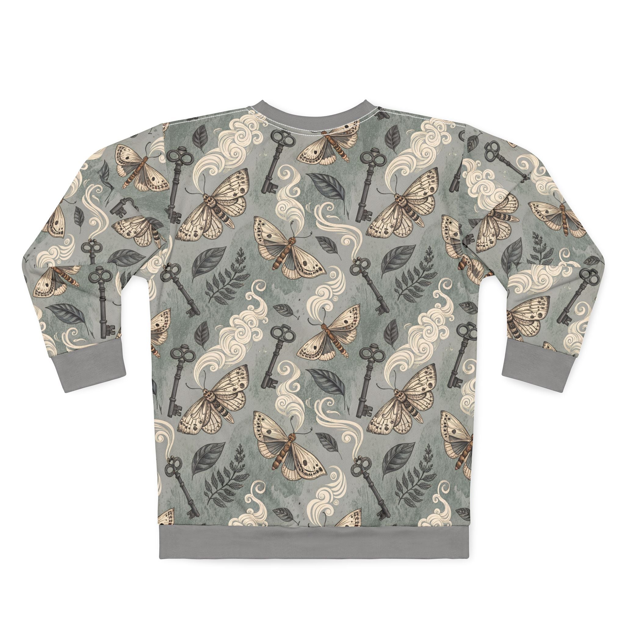 Sweatshirt with moth and key pattern on a gray background