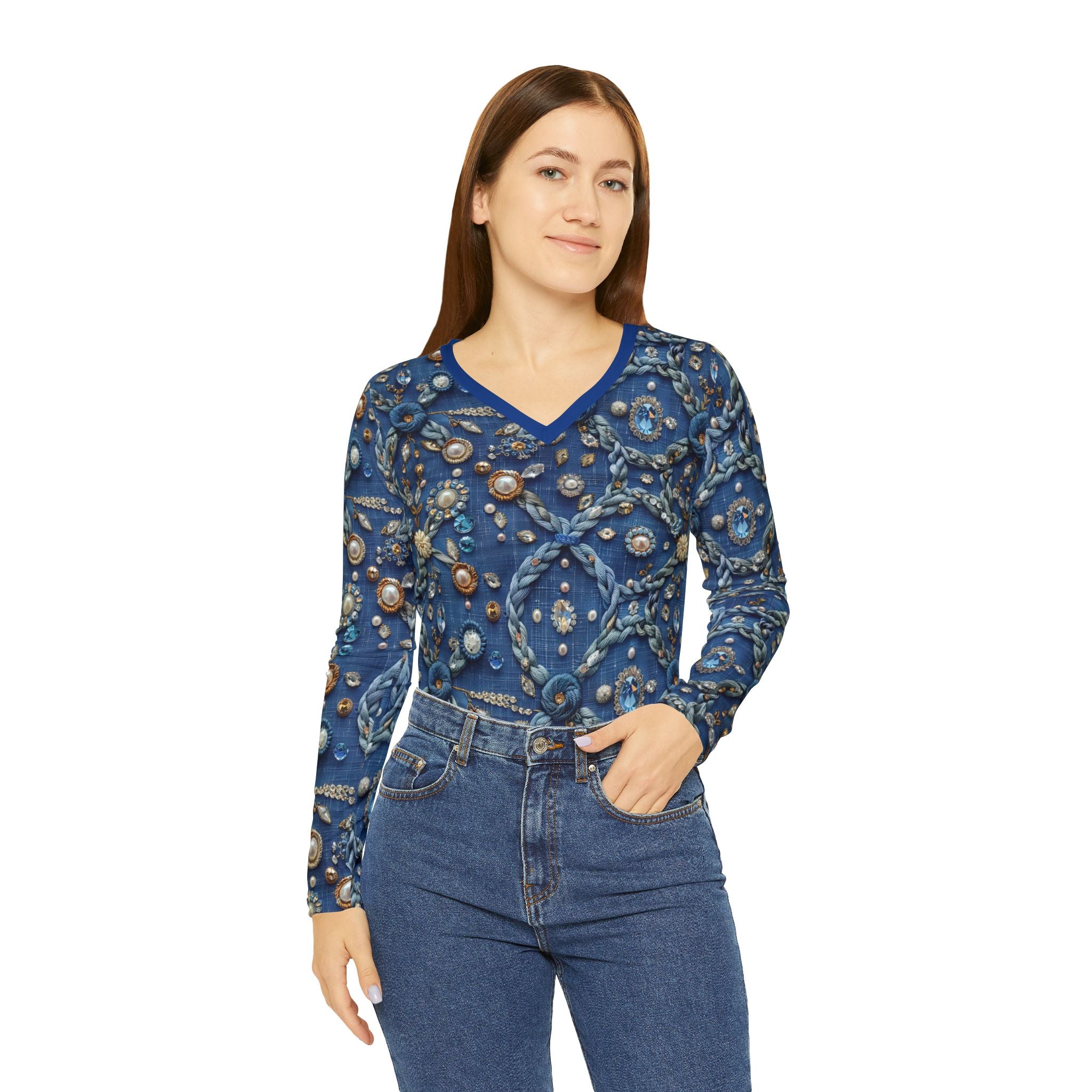 Woman wearing a blue patterned long-sleeve top and jeans on a white background