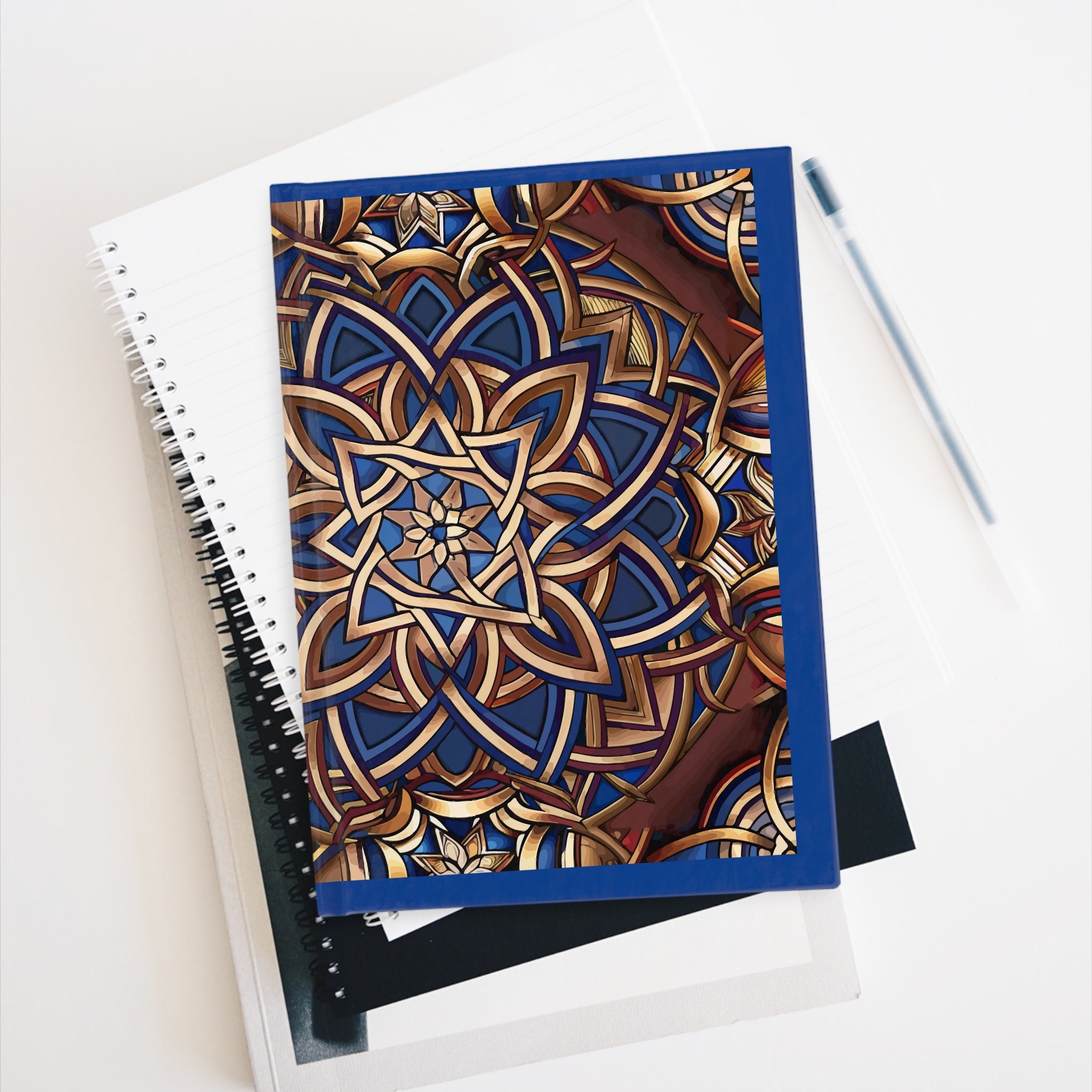 Notebook with a decorative cover on a white surface