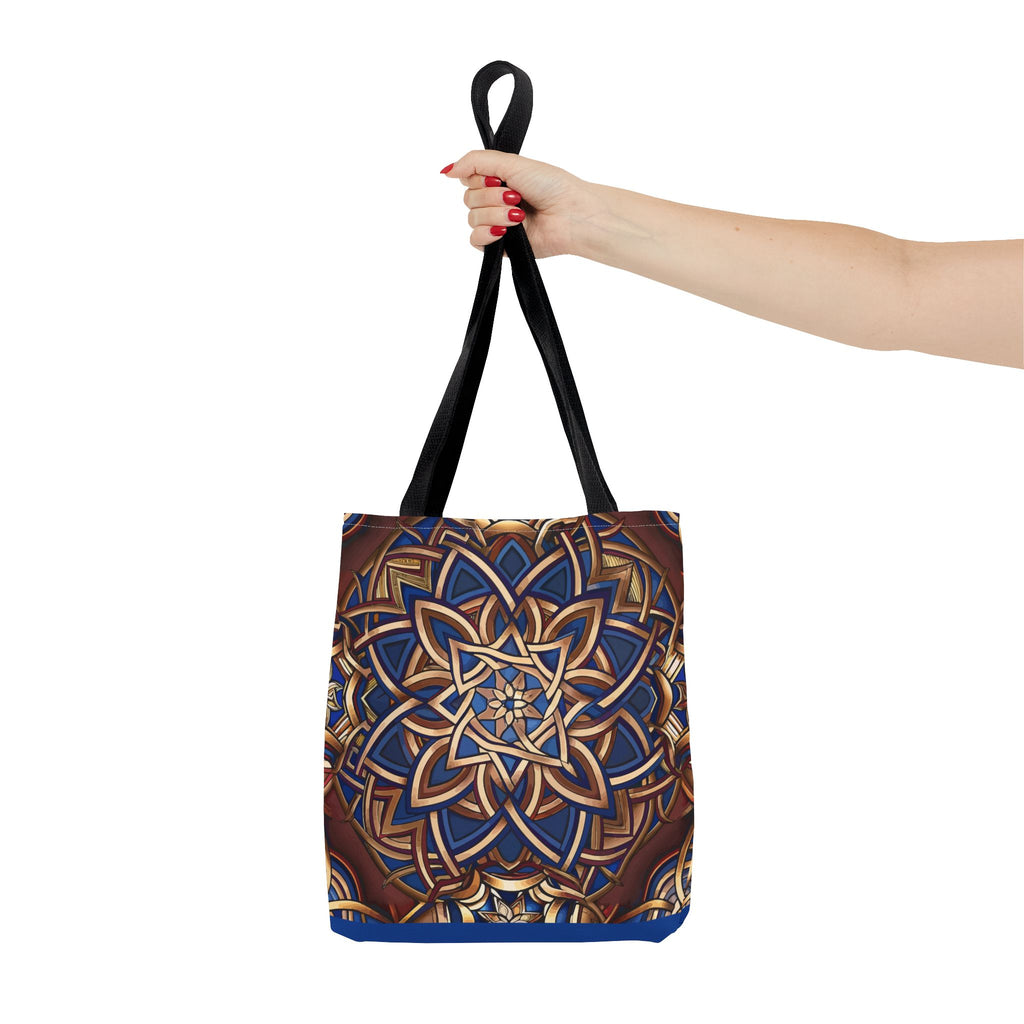 Tote bag with a Celtic design held by a hand on a white background