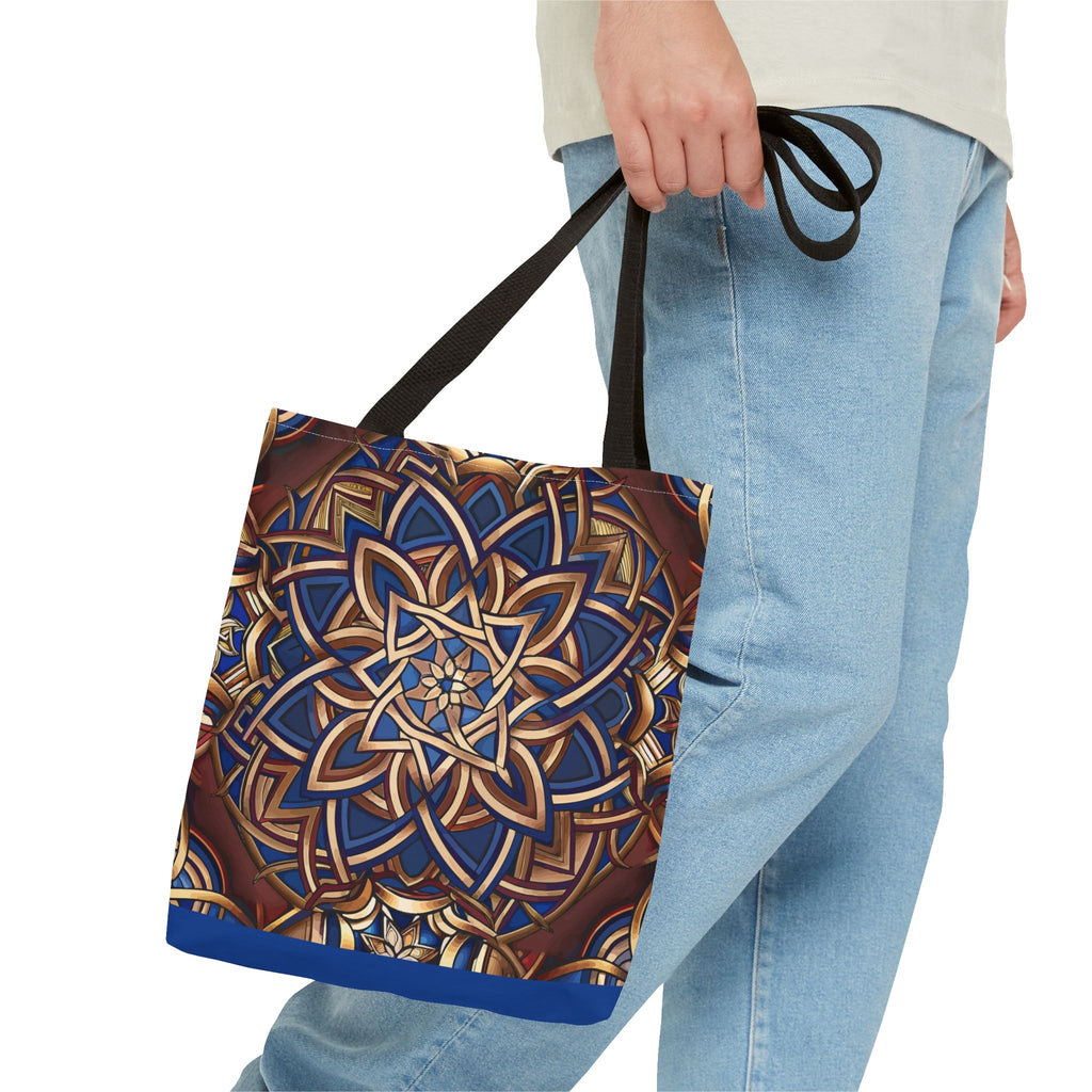 Tote bag with a Celtic pattern held by a person wearing jeans on a white background