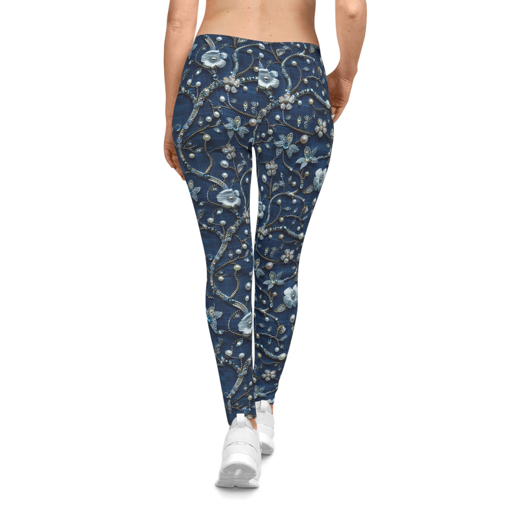 Blue floral patterned leggings worn by a person on a white background