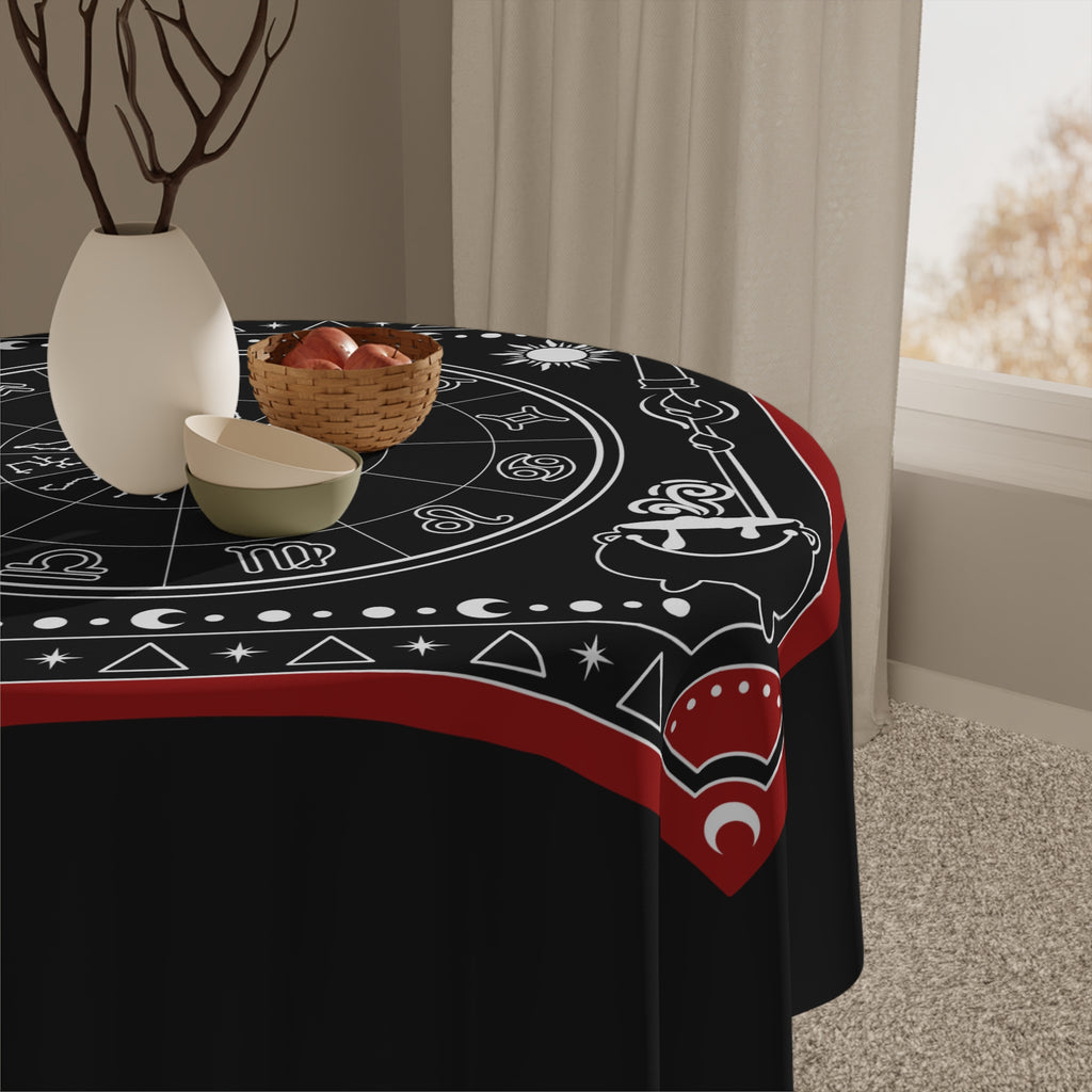 Close up of a Decorative tablecloth with astrological symbols on a black background