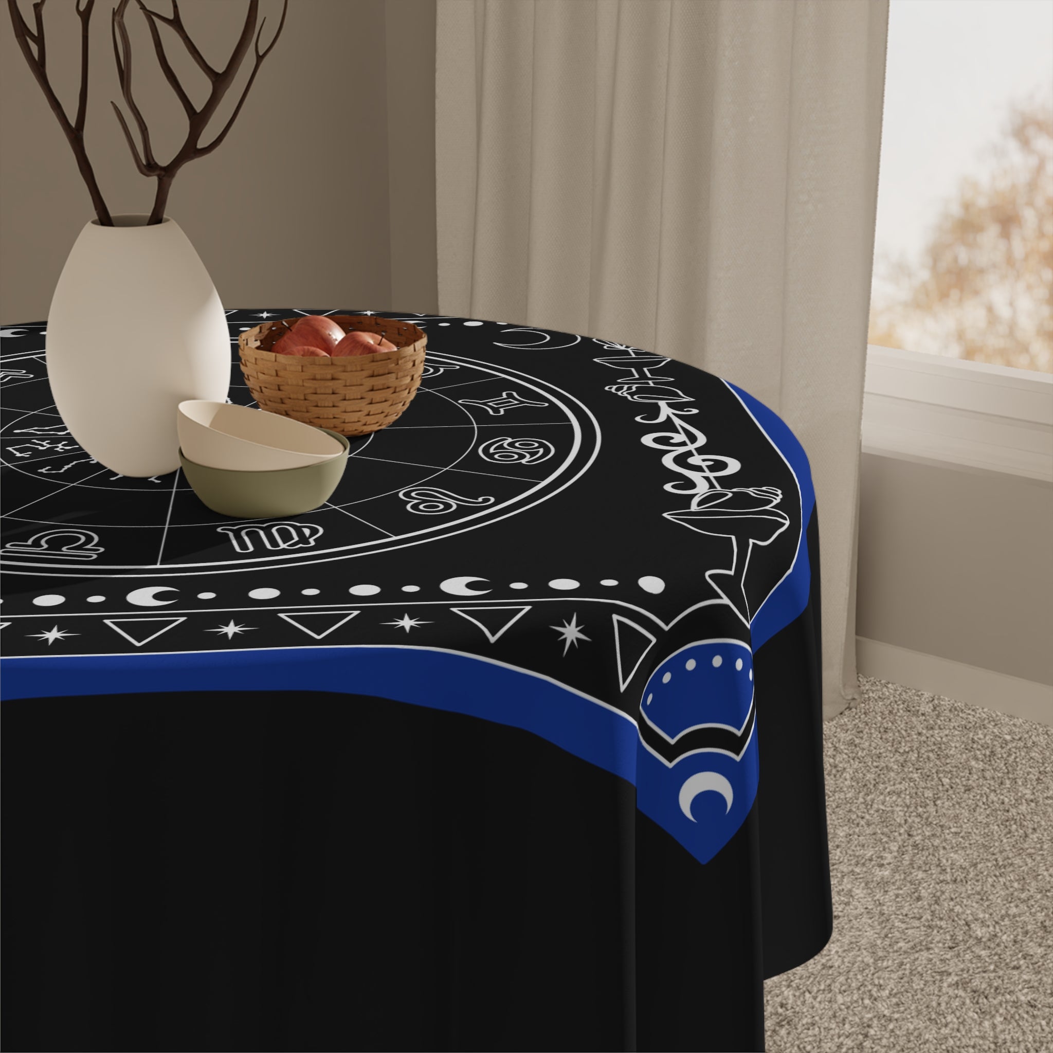 Decorative tablecloth with astrological symbols on a black background