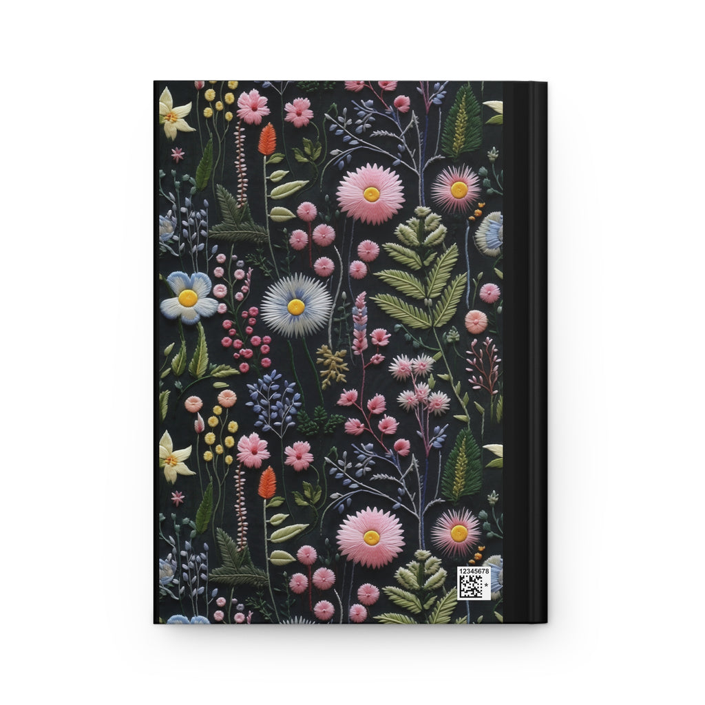 Notebook with floral design on a black background