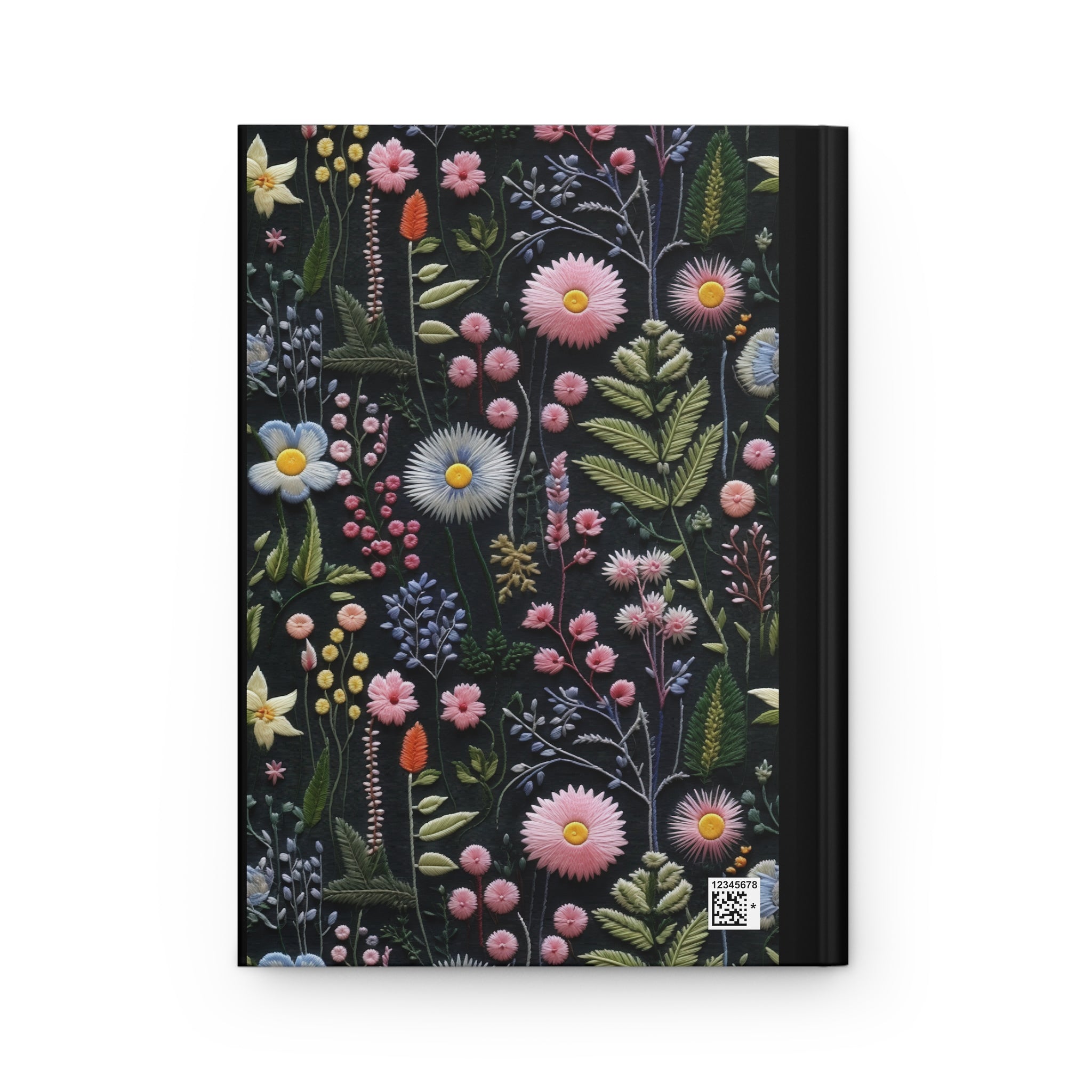 Notebook with floral design on a black background