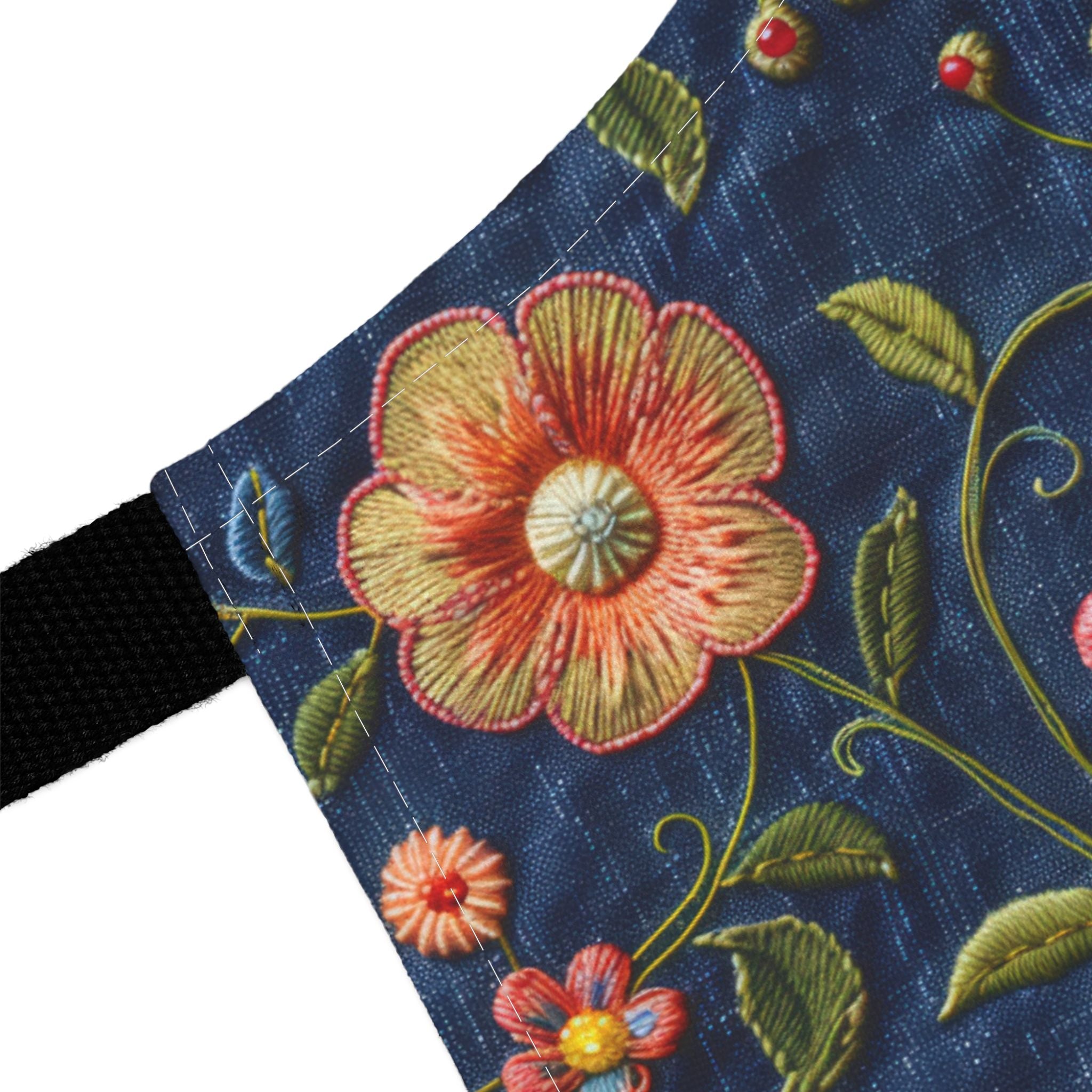 Embroidered floral design on a blue fabric background