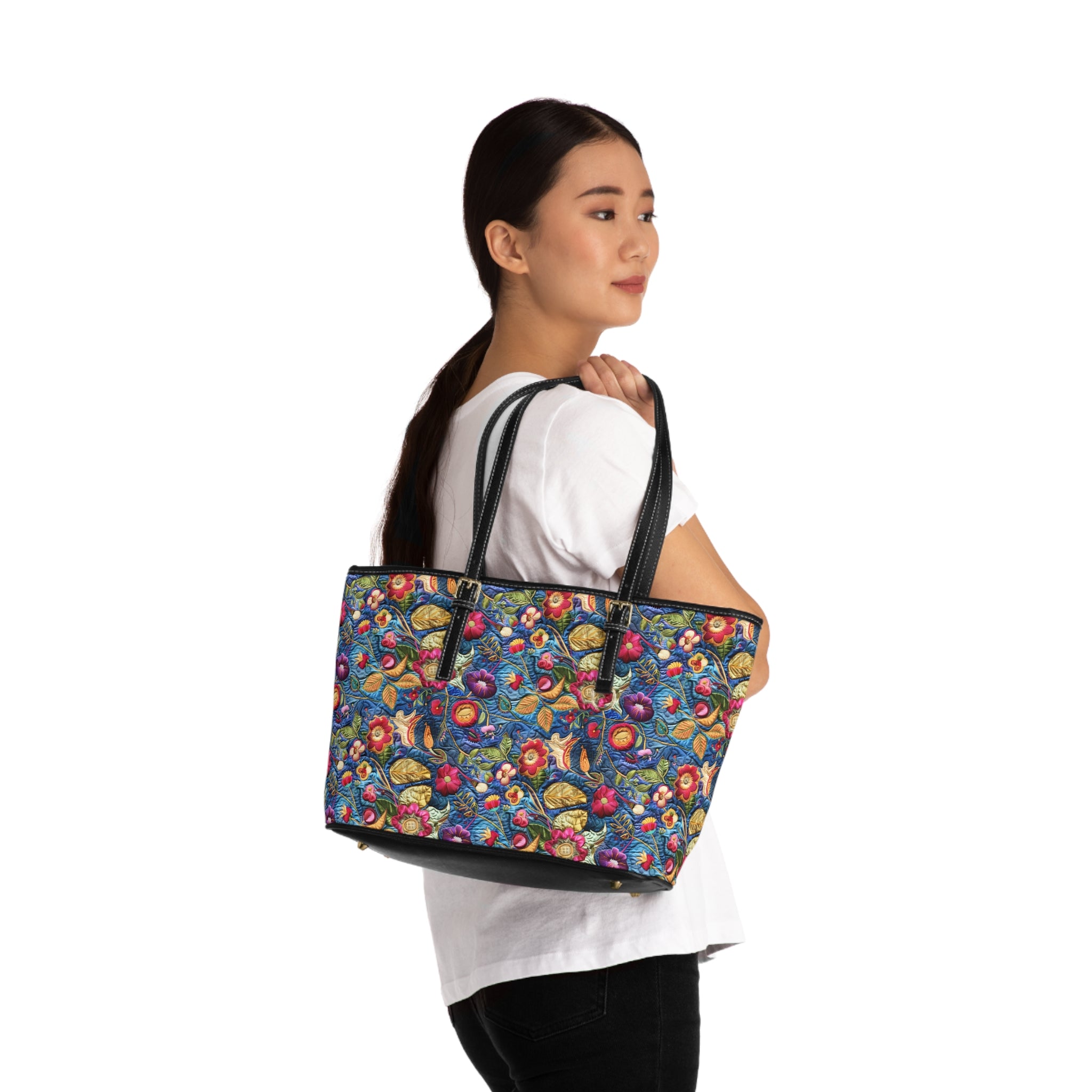 Woman carrying a colorful floral-patterned tote bag on a white background