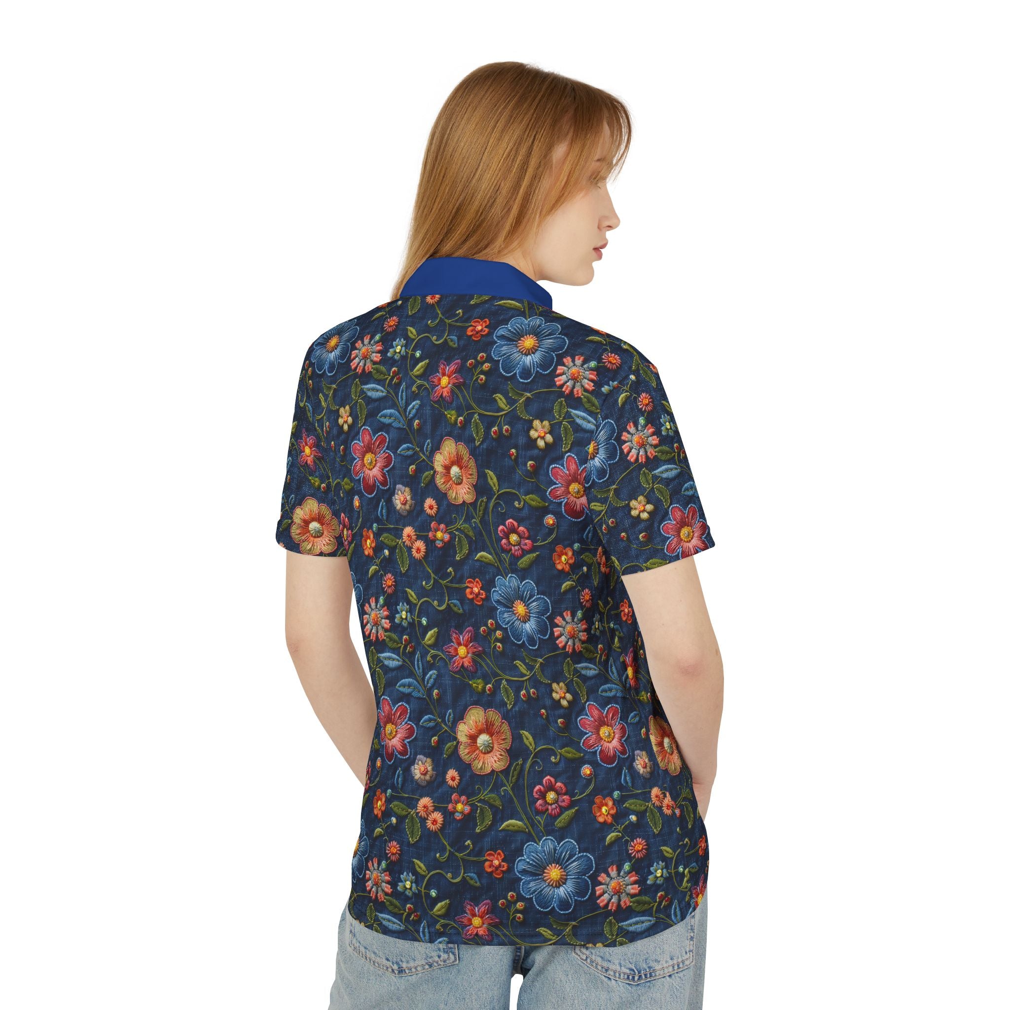 Woman wearing a colorful floral patterned shirt on a white background