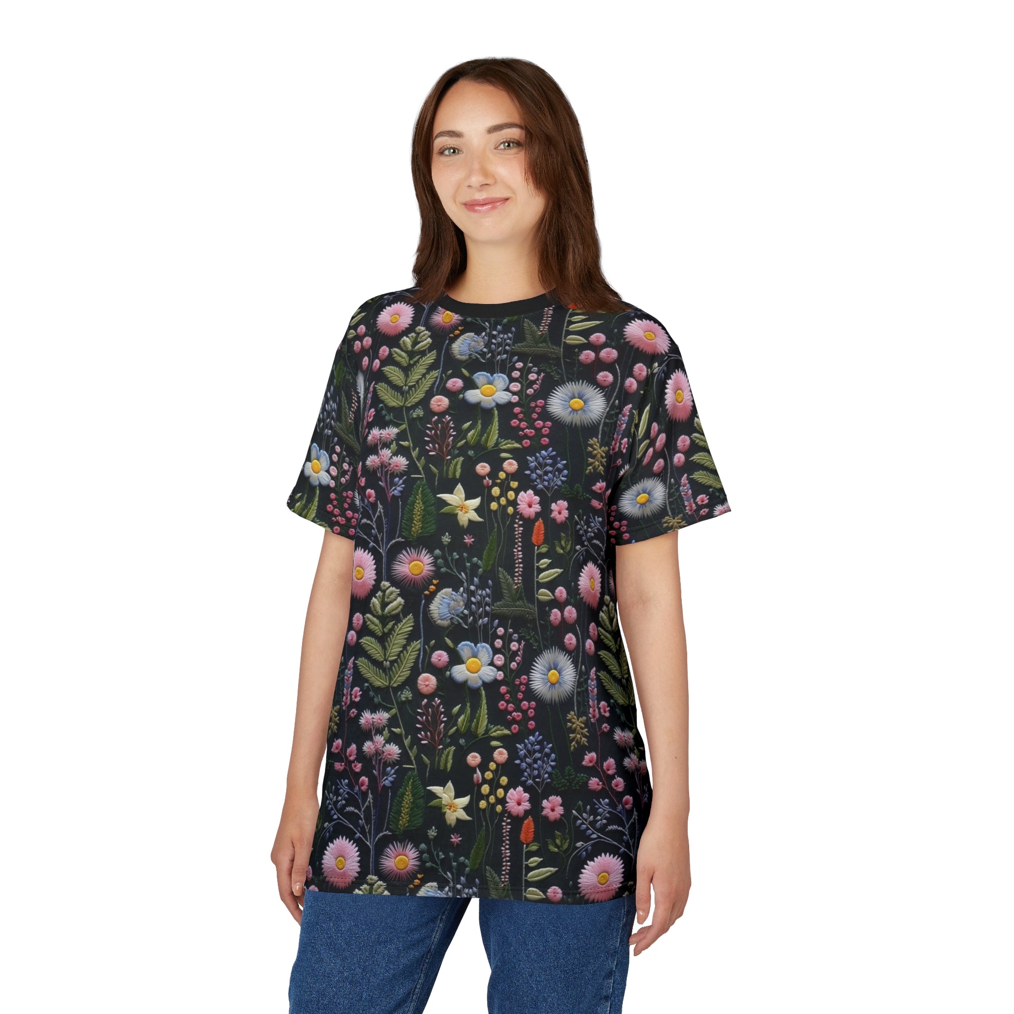 Woman wearing a dark t-shirt with a colorful floral pattern on a white background