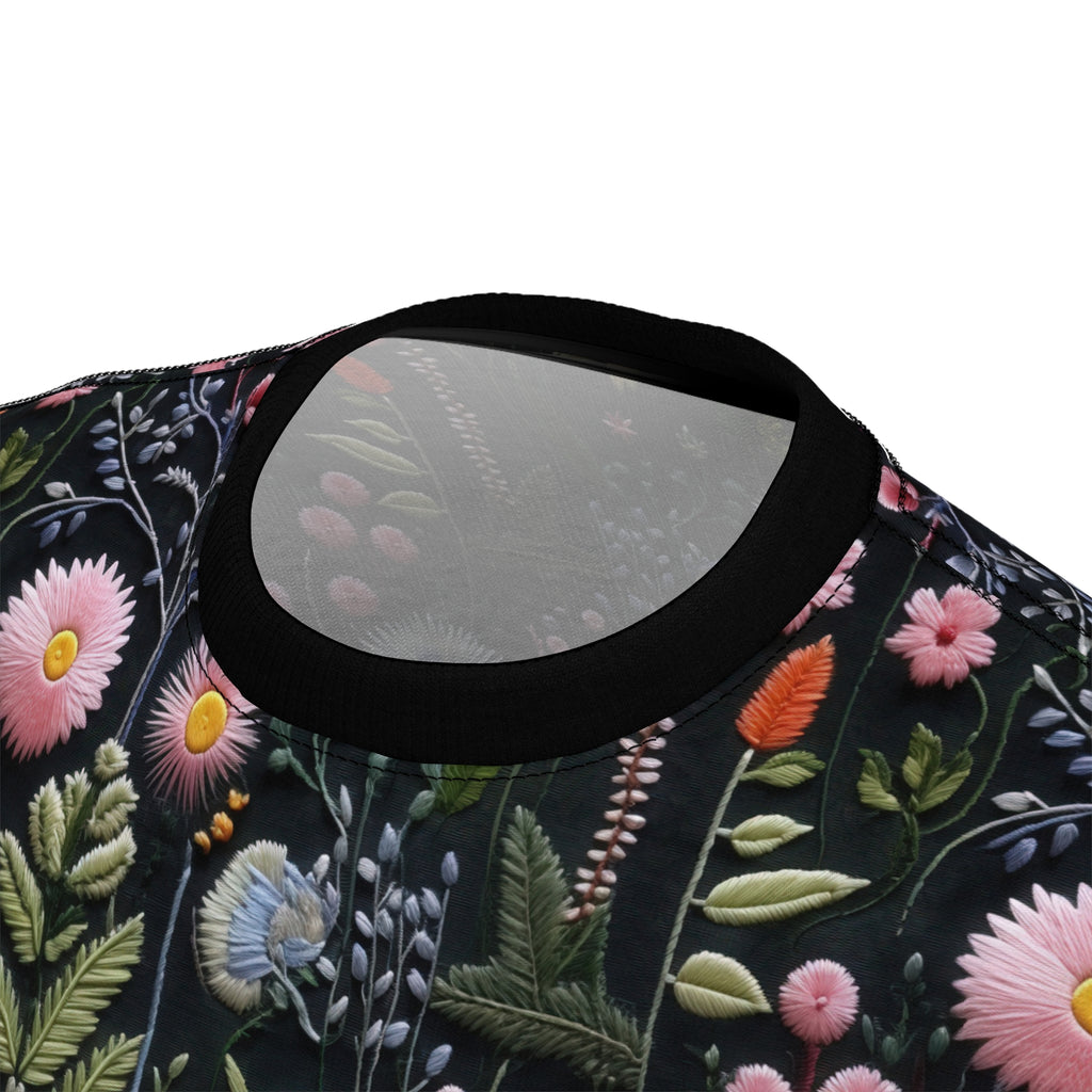 Close-up of a floral embroidered look t-shirt on a black background