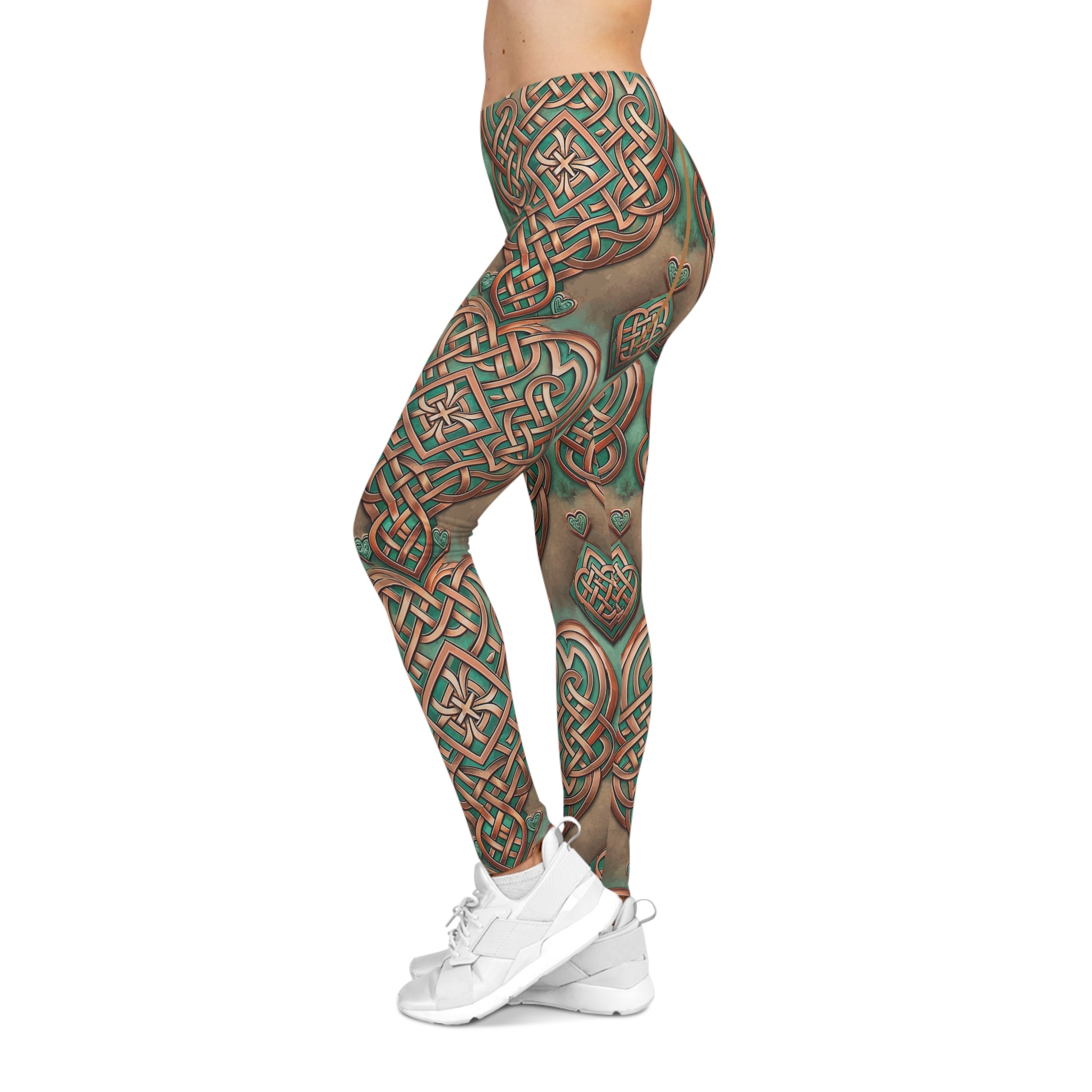 Leggings with intricate green and brown patterns worn by a person on a white background