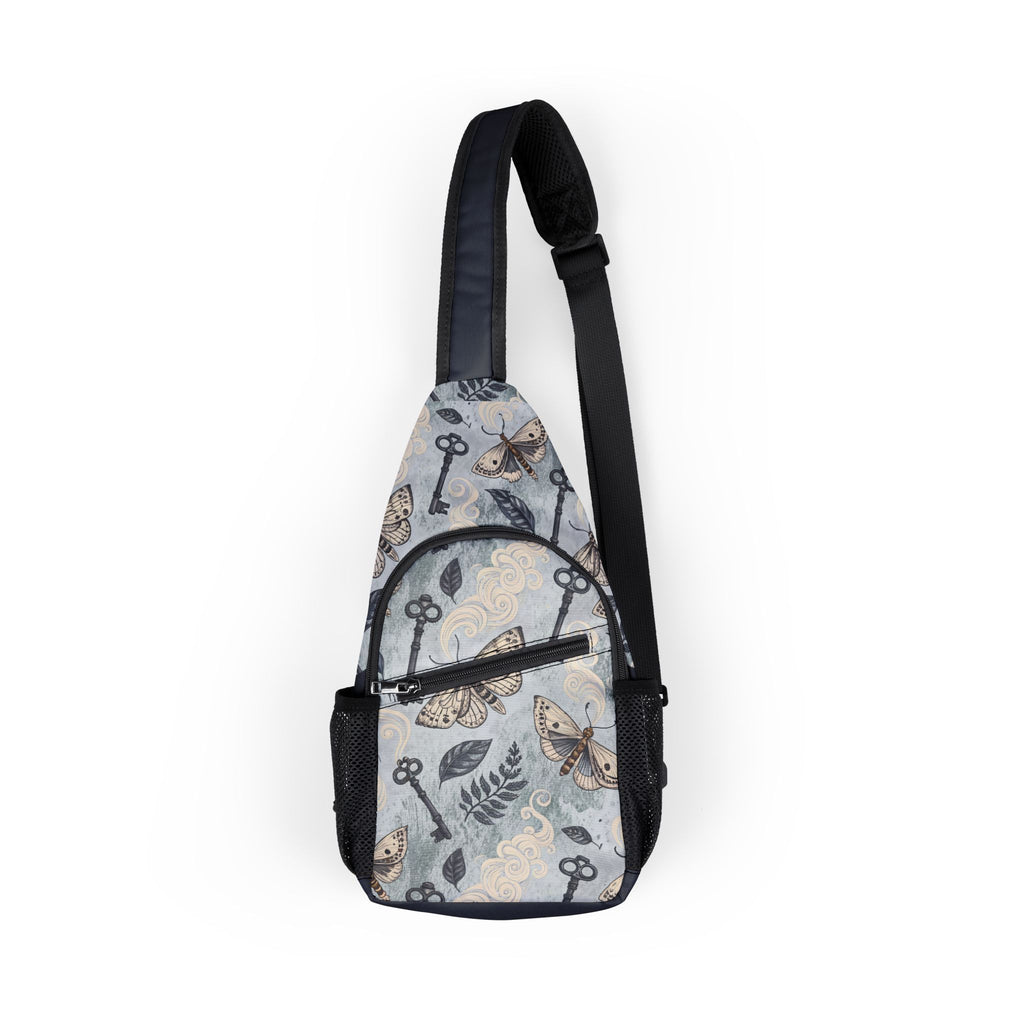 Sling bag with moth and key pattern on a white background
