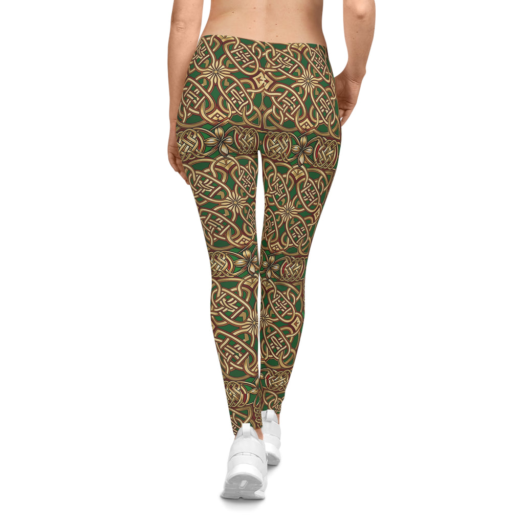 Leggings with a green and brown pattern worn by a person on a white background