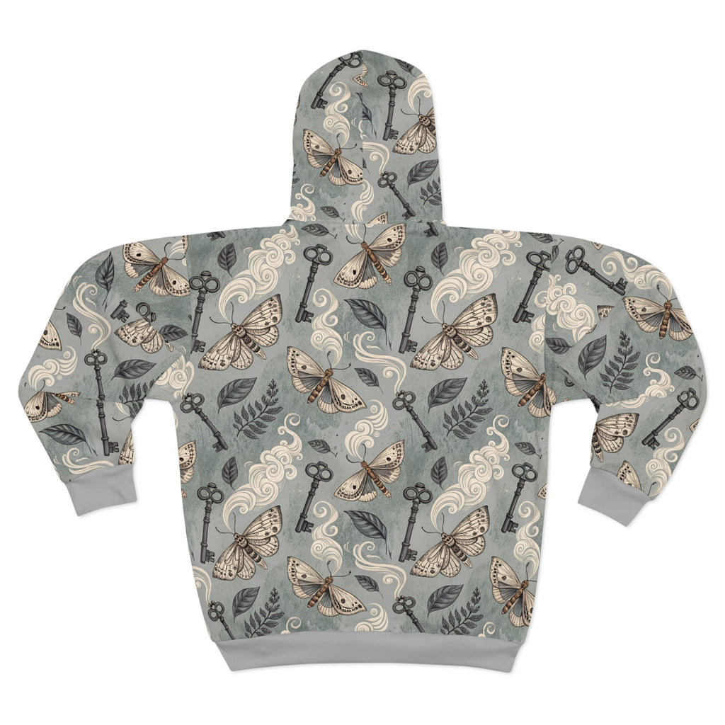 Hoodie with moth and key pattern on a light gray background