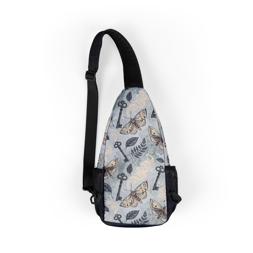 Sling bag with moth and key pattern on a white background