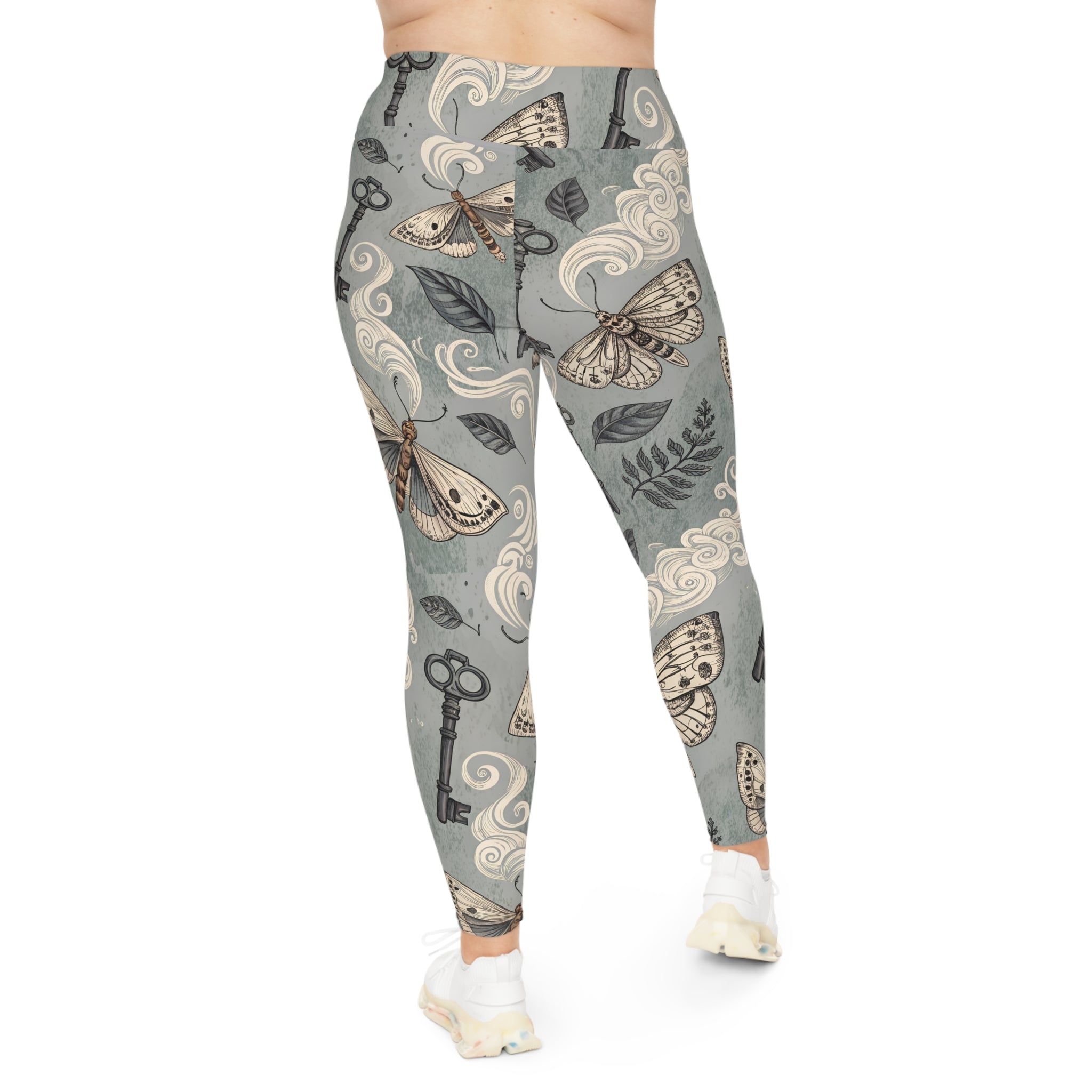 Leggings with moth and key pattern on a gray background