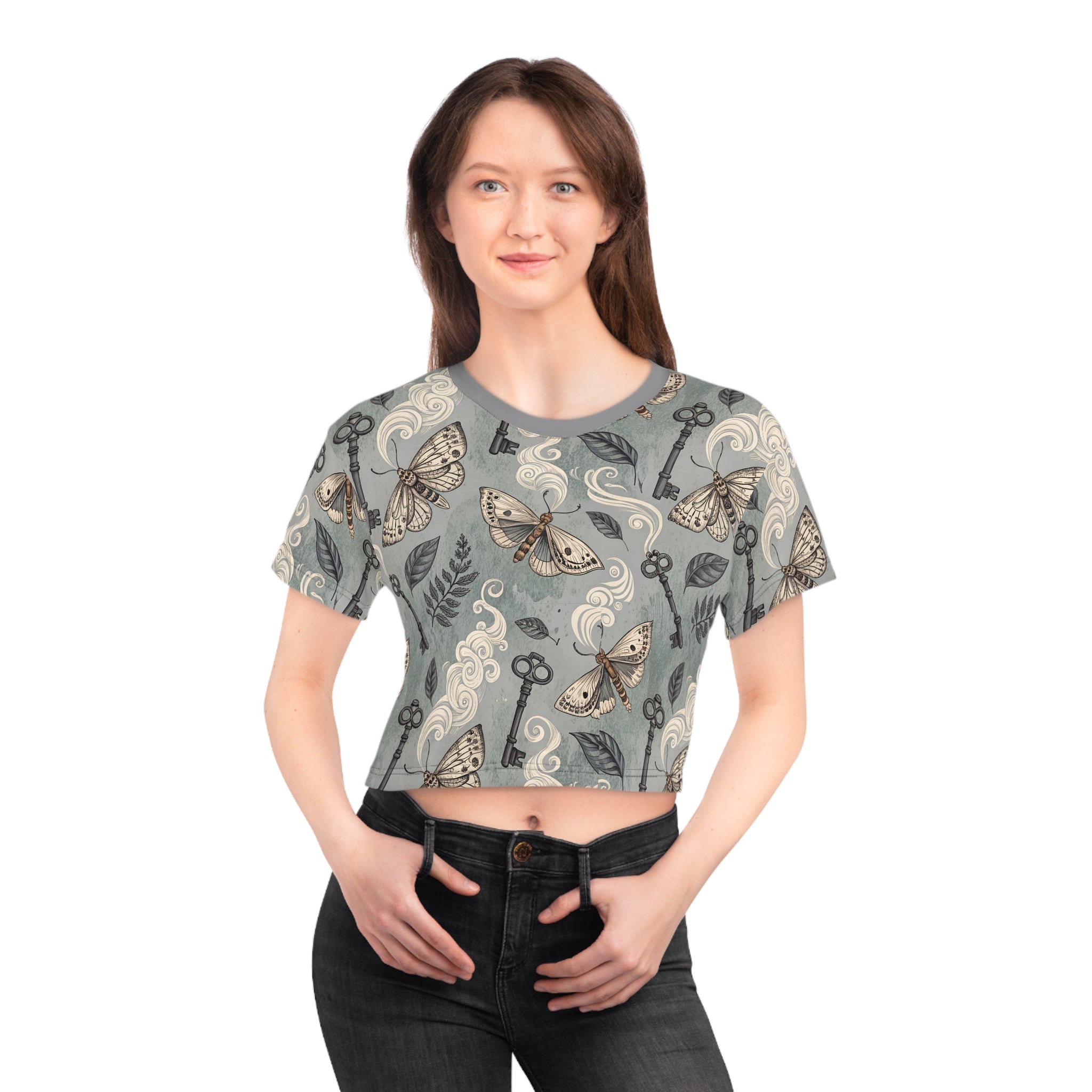 Woman wearing a crop top with intricate pattern on a white background