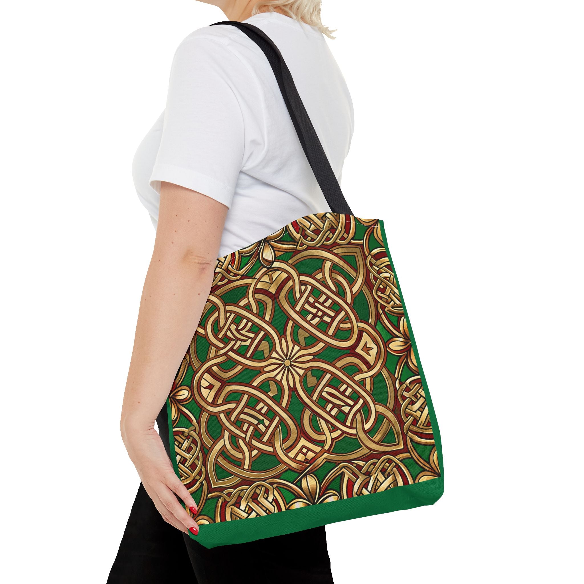 Person holding a green and gold patterned bag