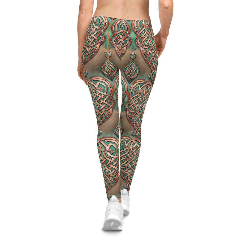 Leggings with intricate green and brown patterns on a white background