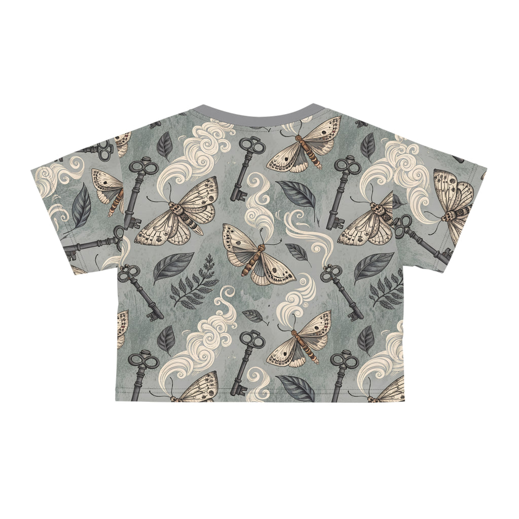 T-shirt with moth and key pattern on a gray background