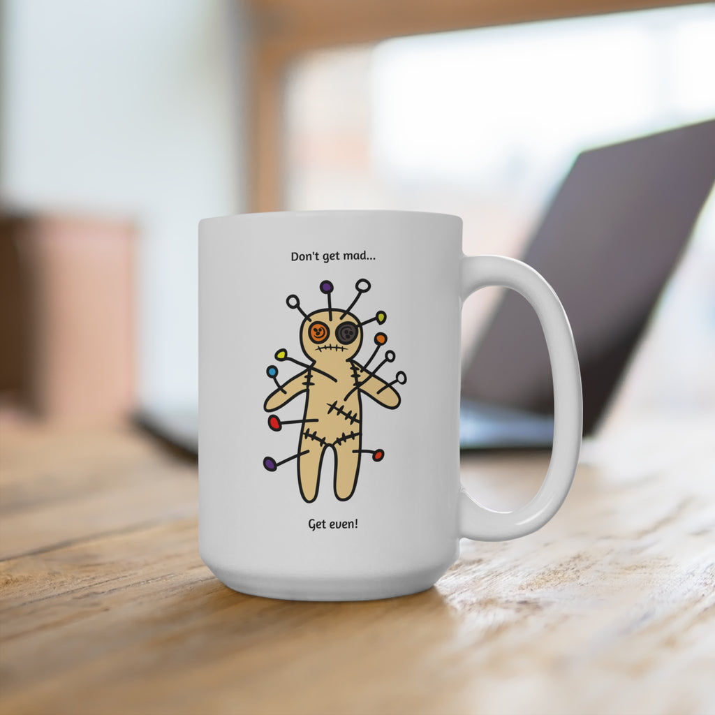 White mug with a voodoo doll illustration and text on a wooden surface.