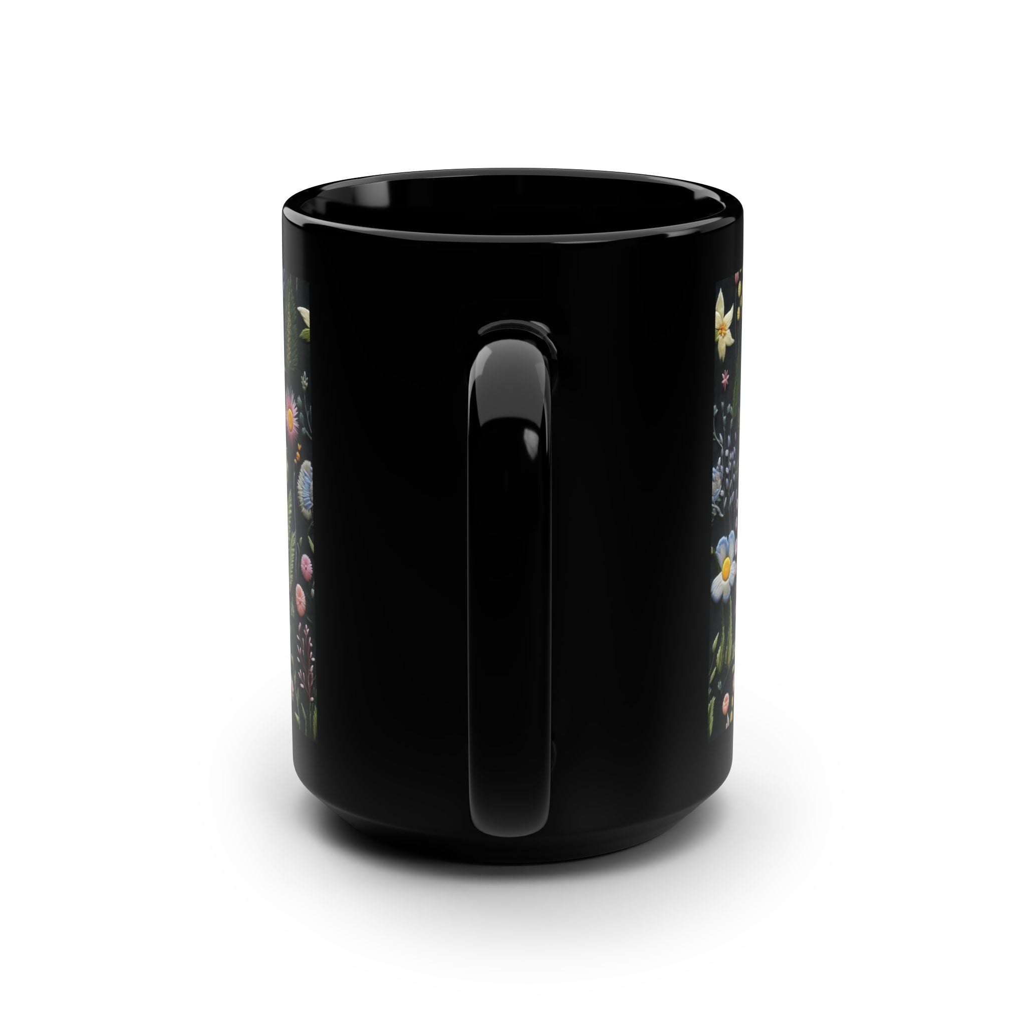 Black mug with colorful designs on a white background