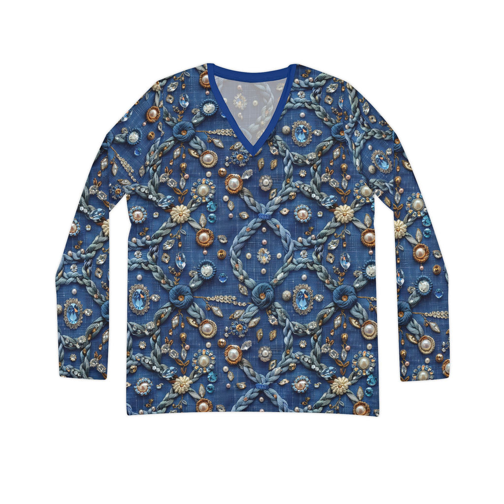 Blue sweater with intricate bead and button detailing on a white background