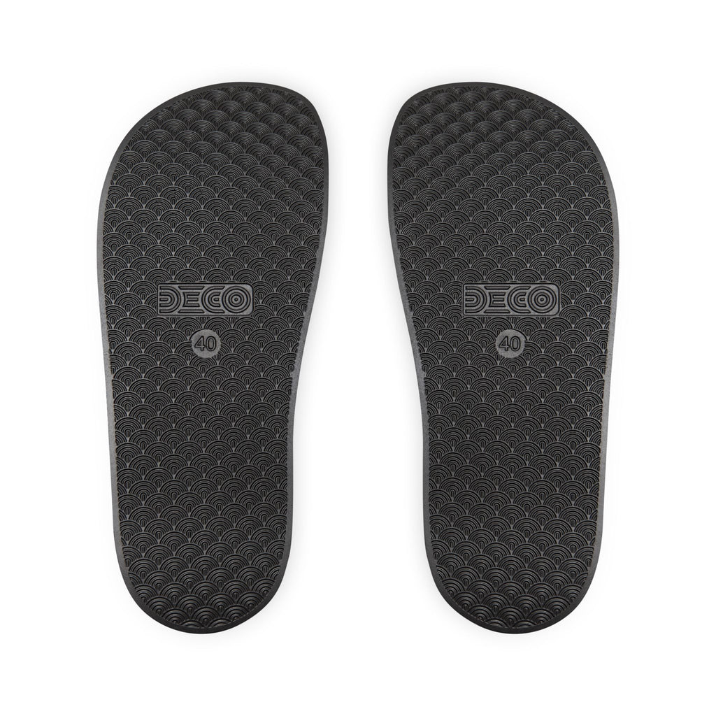 Black shoe soles with DECO branding on a white background