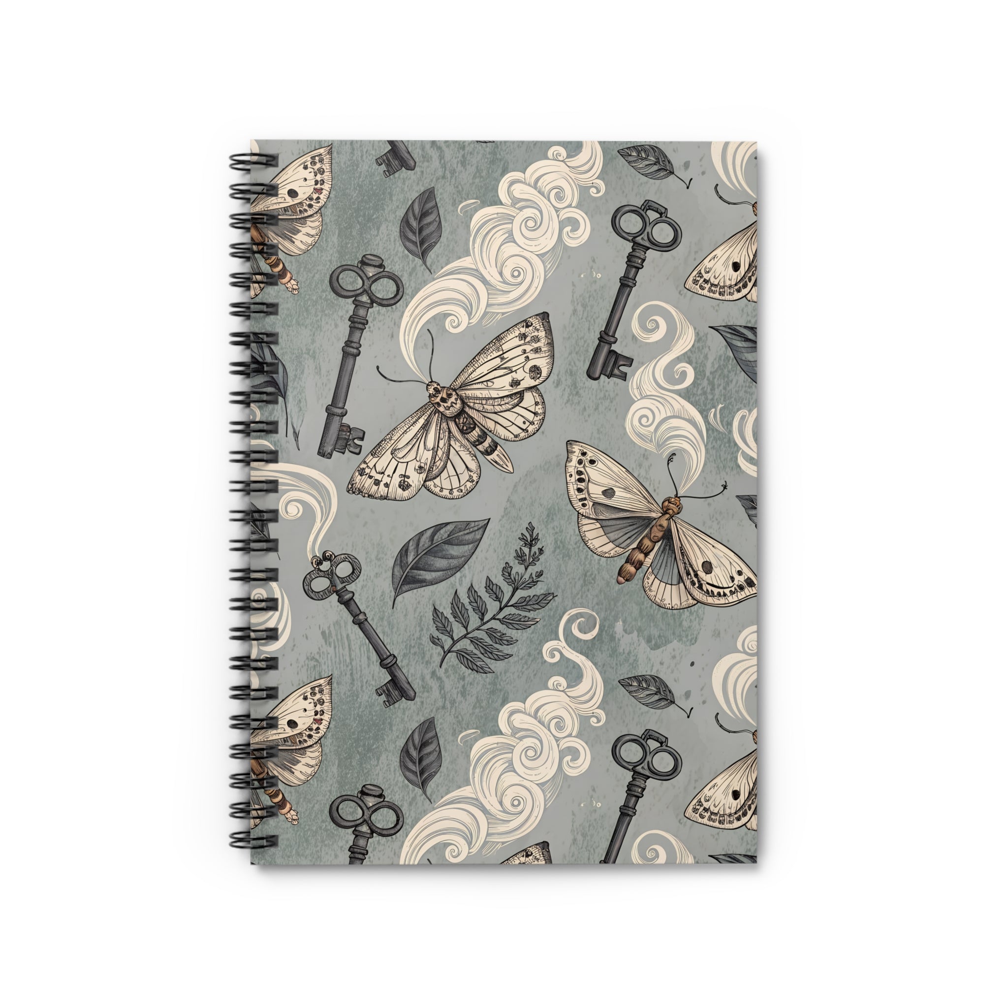 Notebook with moth and key design on a gray background