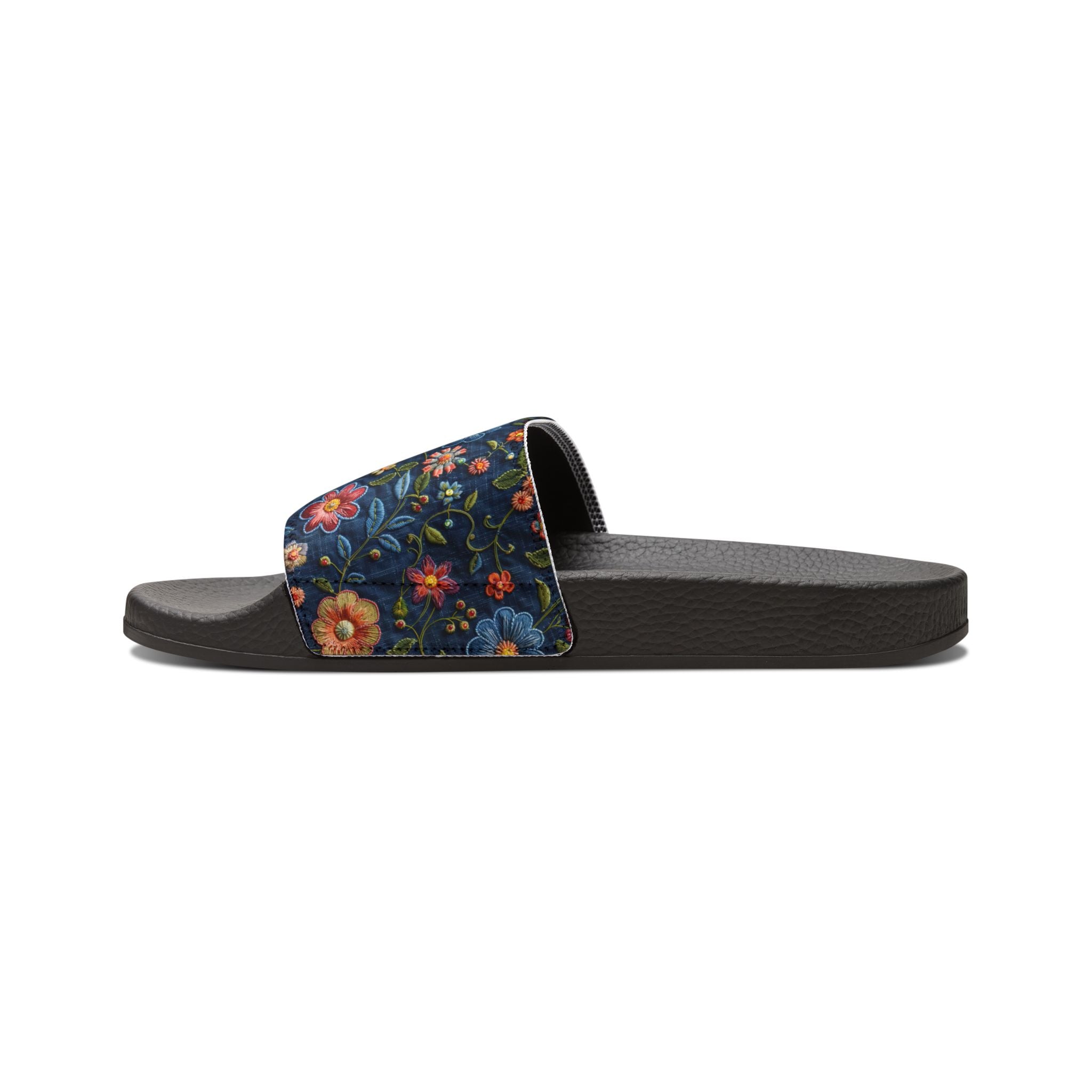 Black slide sandal with floral strap on a white background