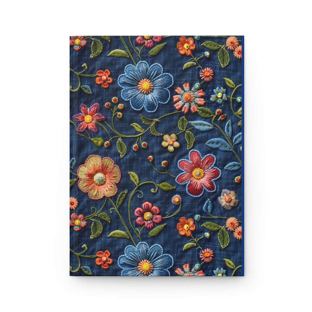 Embroidered floral design on denim fabric with colorful flowers and leaves.