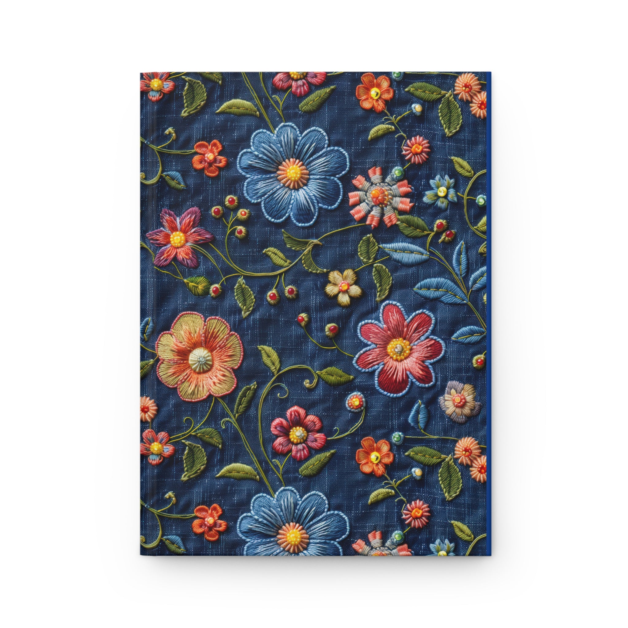Embroidered floral design on denim fabric with colorful flowers and leaves.