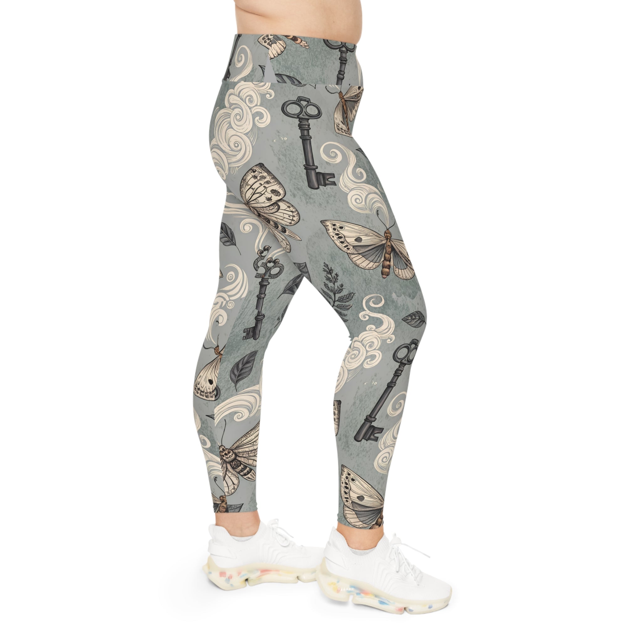 Leggings with moth and key pattern on a gray background