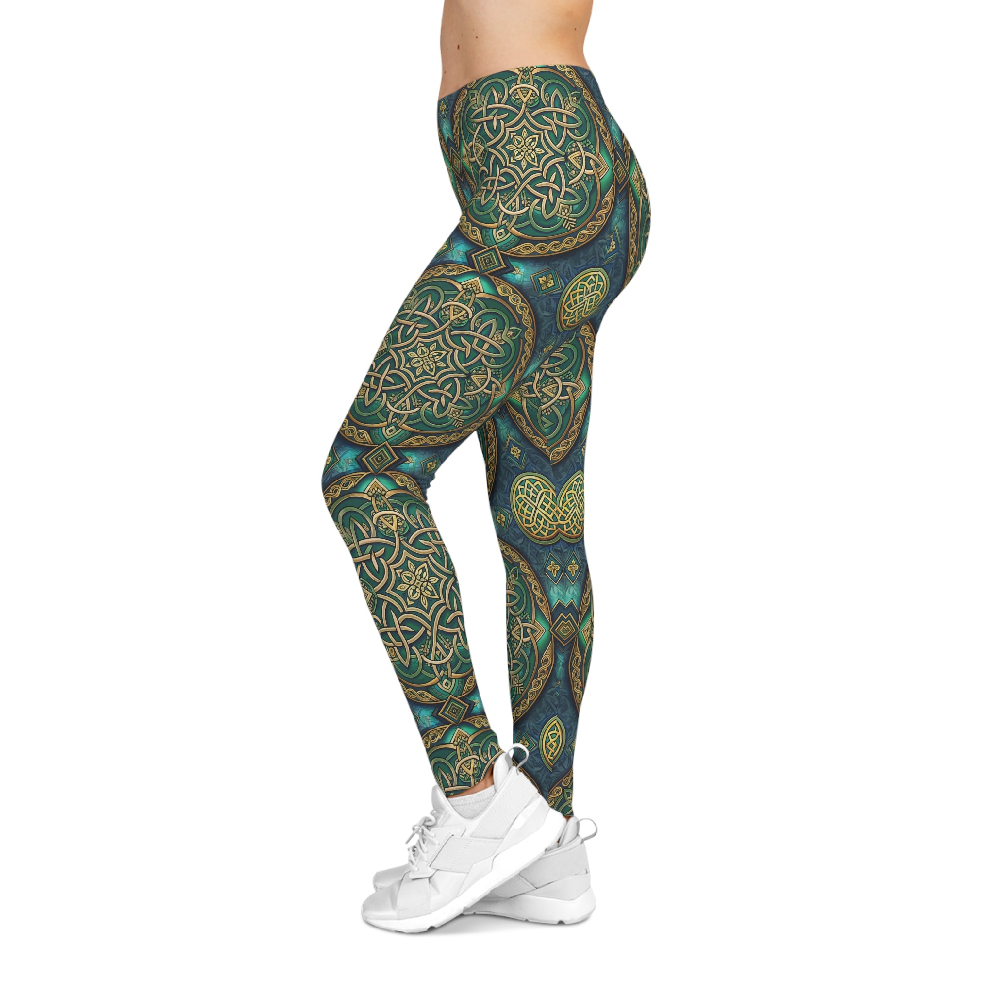 Leggings with a Celtic green and gold pattern worn by a person on a white background