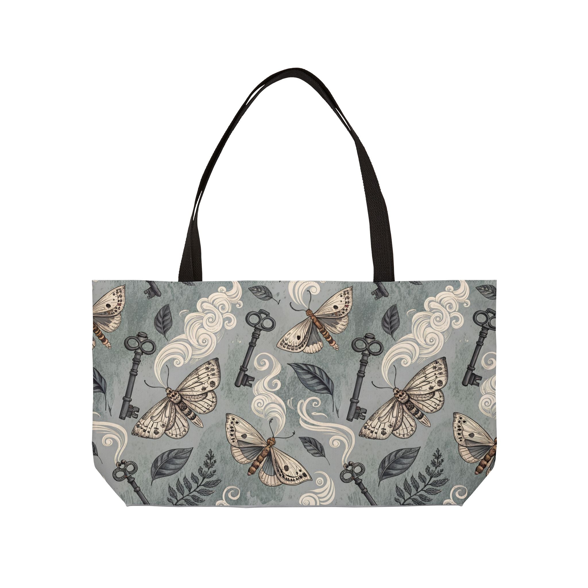Tote bag with moth and key pattern on a gray background
