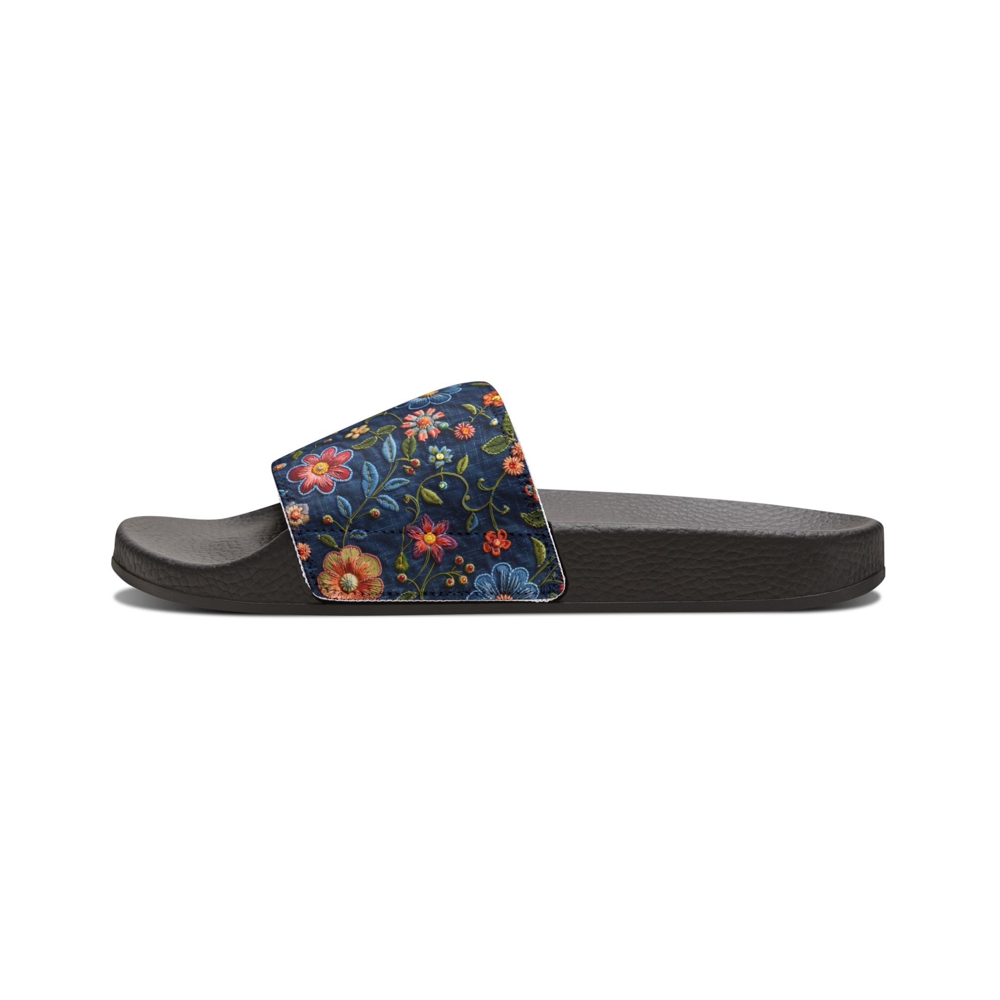 Black slide sandal with a floral strap on a white background