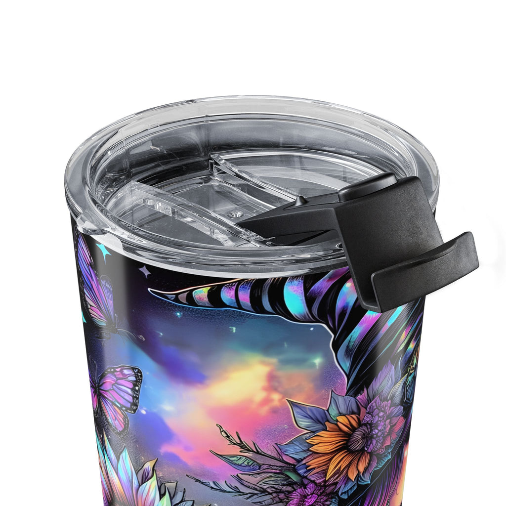 Close up of Tumbler with a witch design featuring flowers on a black background