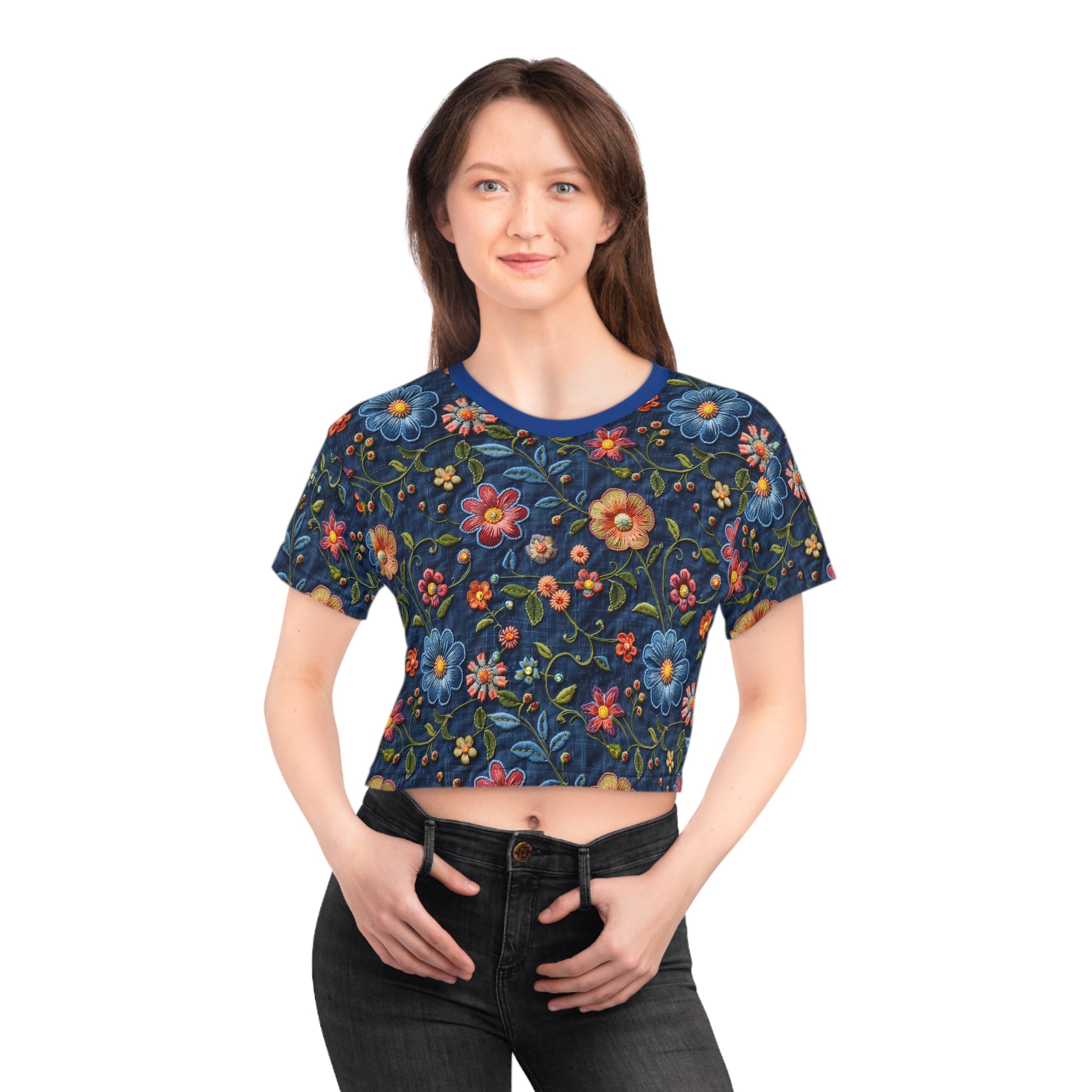 Woman wearing a colorful floral-patterned crop top on a white background